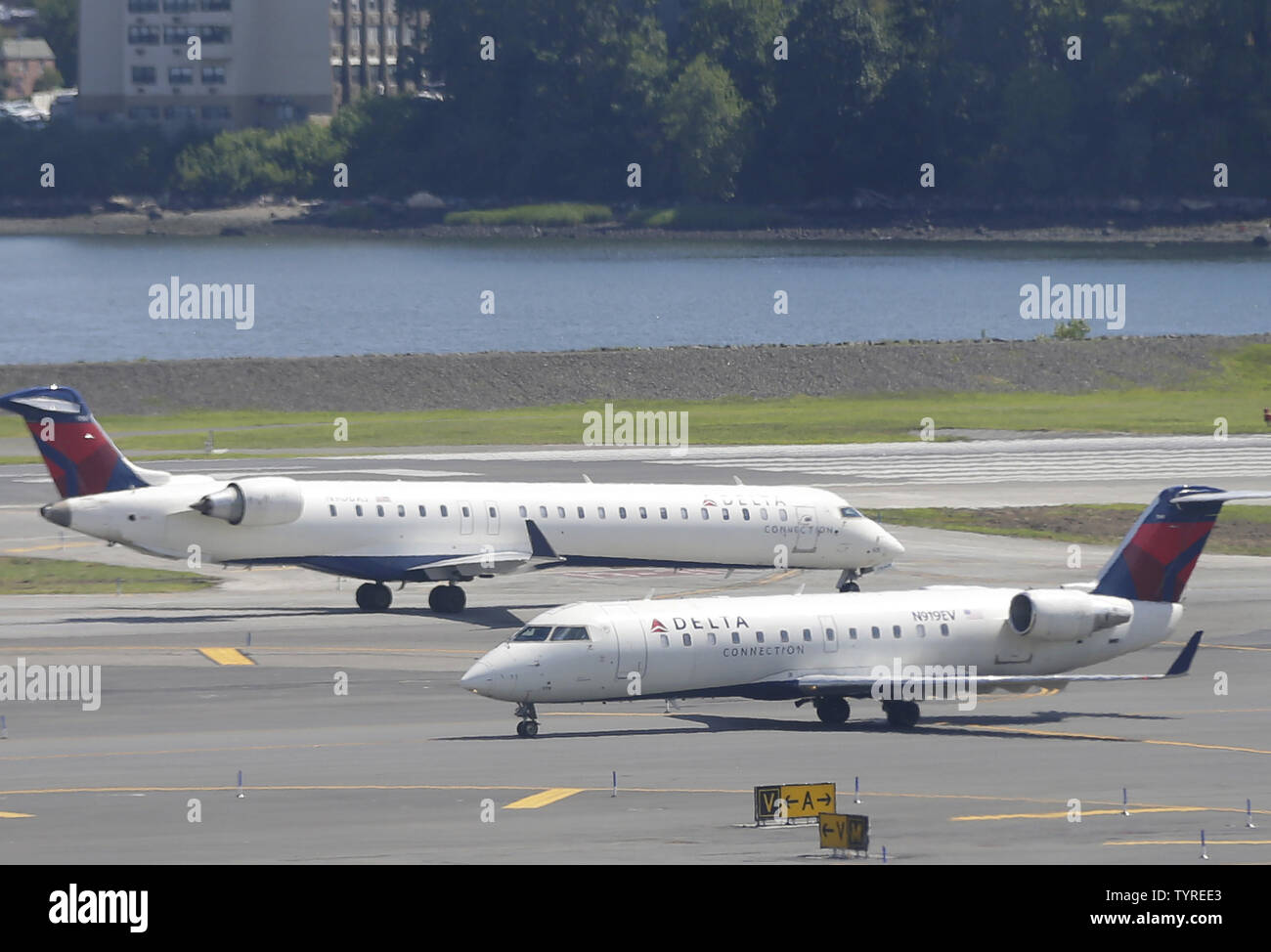 Two Delta Airlines planes move on the runway LaGuardia Airport in New York City on August 8, 2016 in New York City. Delta began to resume flights but still expect massive cancelations and delays after after a computer glitch shut down the airline completely this morning.    Photo by John Angelillo/UPI Stock Photo
