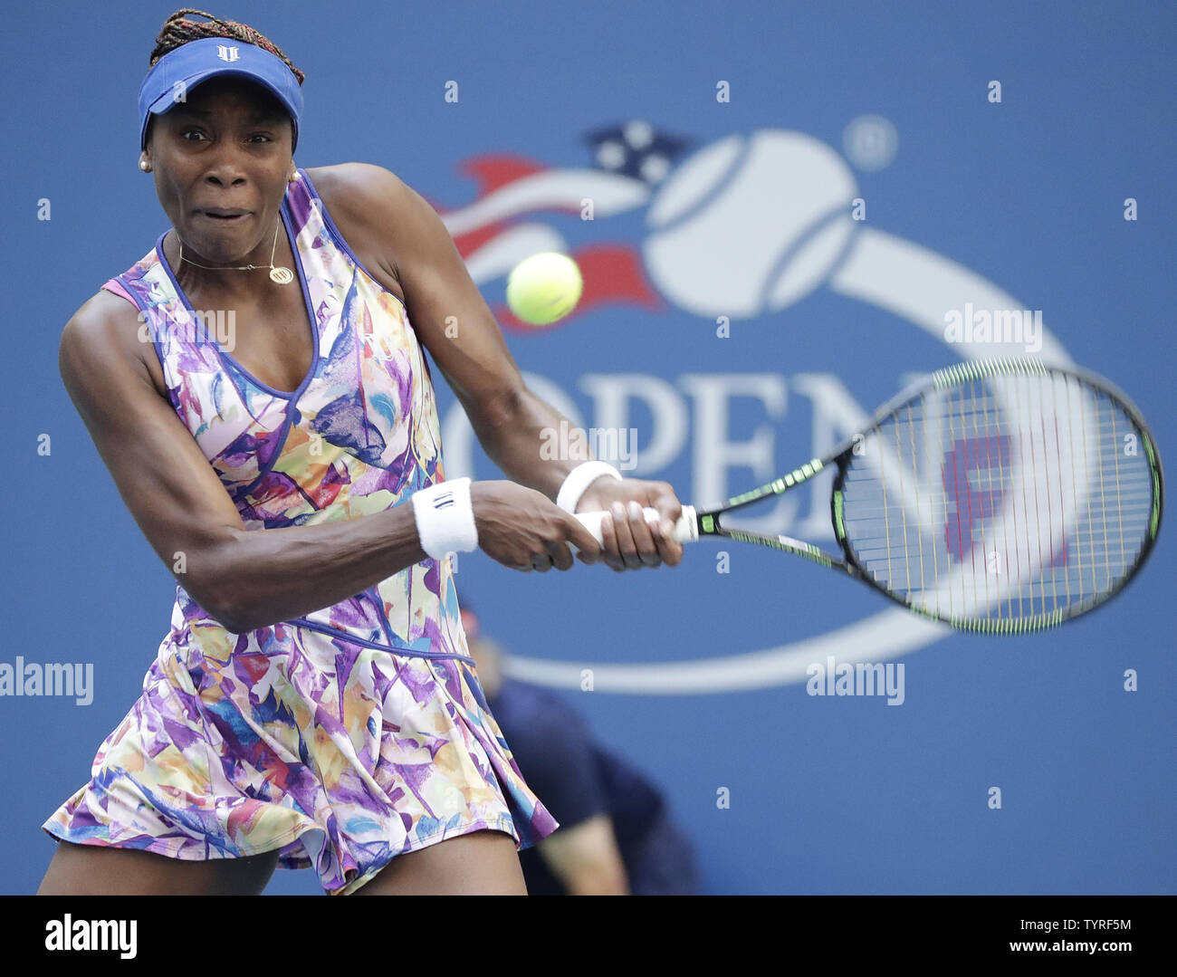 Venus Williams of the United States returns a ball to Kateryna Kozlova of the Ukraine in their first round match at the 2016 US Open Tennis Championships at the USTA Billie Jean King National Tennis Center in New York City on August 30, 2016.      Photo by John Angelillo/UPI Stock Photo