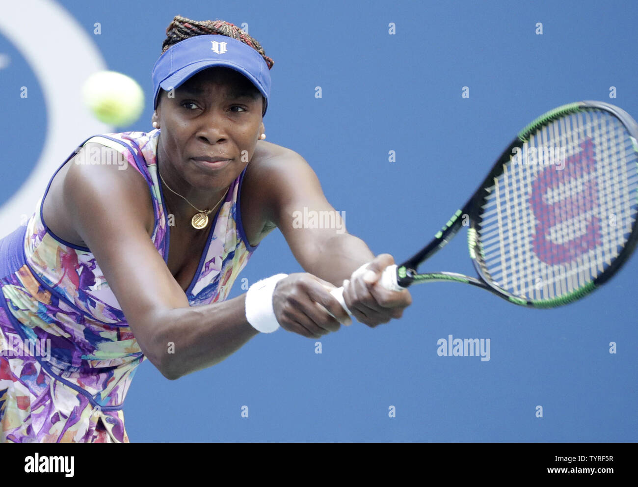 Venus Williams of the United States hits a backhand to Kateryna Kozlova of the Ukraine in their first round match at the 2016 US Open Tennis Championships at the USTA Billie Jean King National Tennis Center in New York City on August 30, 2016.      Photo by John Angelillo/UPI Stock Photo