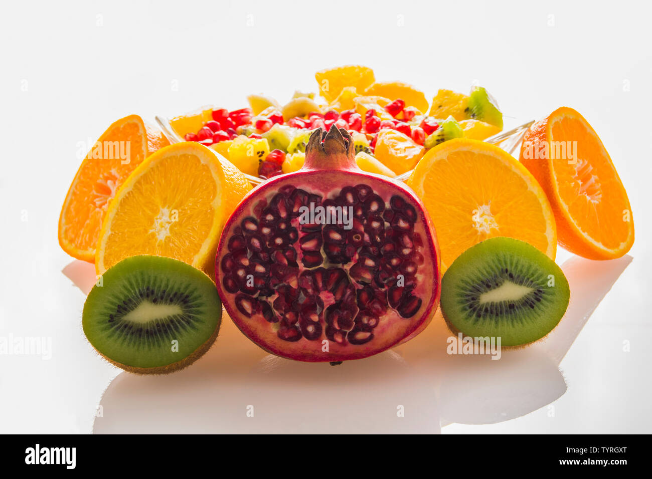 Fruit mix orange pomegranate kiwi mandarin Stock Photo Alamy
