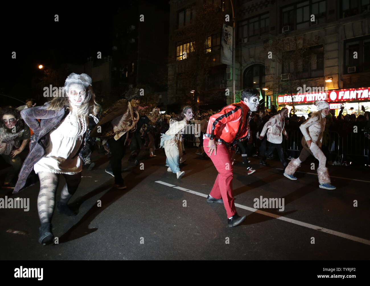 A group of participants act out Michael Jackson's Thriller video as they march up Sixth Avenue in costume at the 43rd annual Halloween Parade on October 31, 2016 in New York City. Thousands participate in the parade which features traditional and non-traditional costumes, dancers, giant puppets and music.     Photo by John Angelillo/UPI Stock Photo