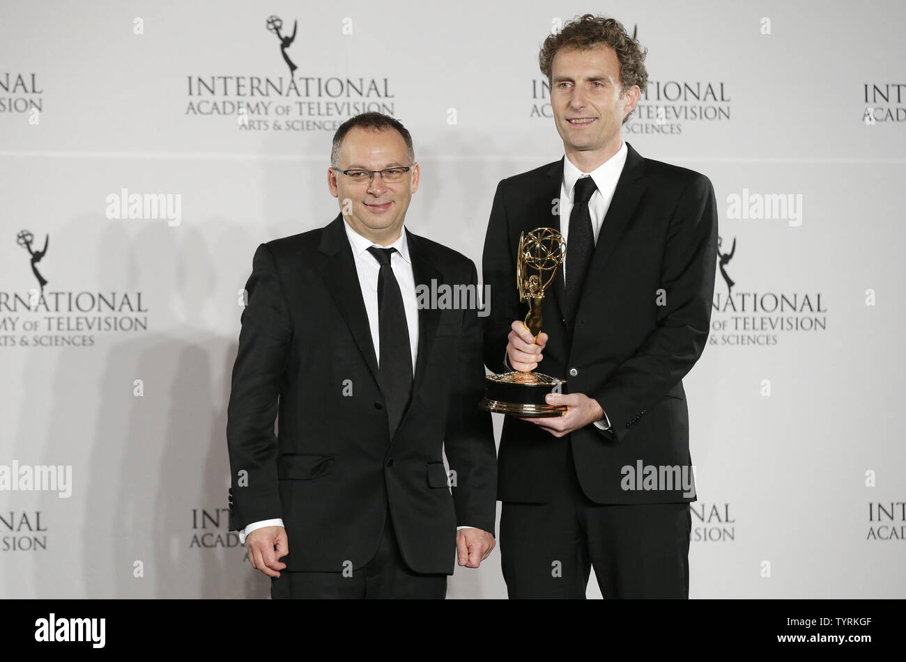 Derek Wax and Euros Lyn stand with the 'TV Movie/Mini-Series' award in the press room at the 44th International Emmy Awards at the New York Hilton in New York City on November 21, 2016.       Photo by John Angelillo/UPI Stock Photo