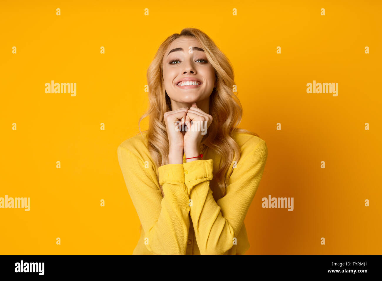 Pretty Girl Pleading For Something And Keeping Hands Together Stock Photo