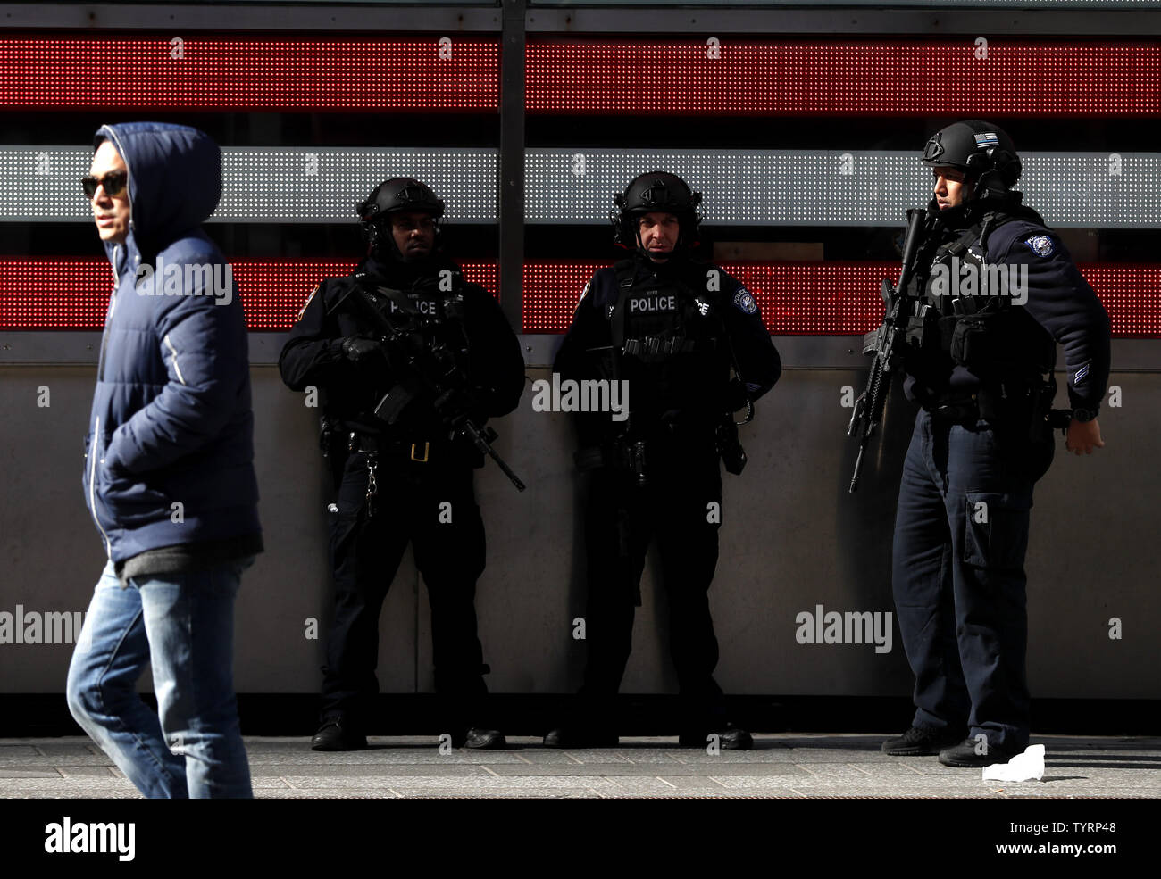 3 NYPD Police officers stand guard in Times Square on Valentine's Day ...
