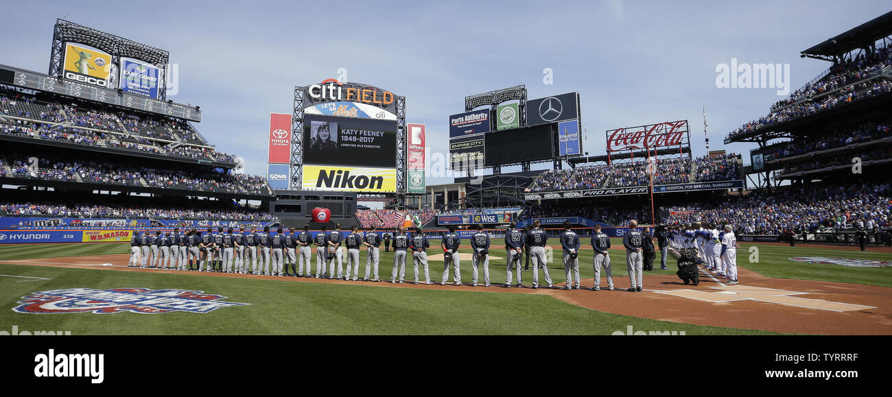 The Atlanta Braves Stand On The Foul Line At Citi Field During