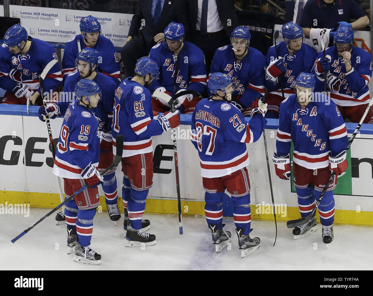 New York Rangers players wait by the bench in a time out in the third ...