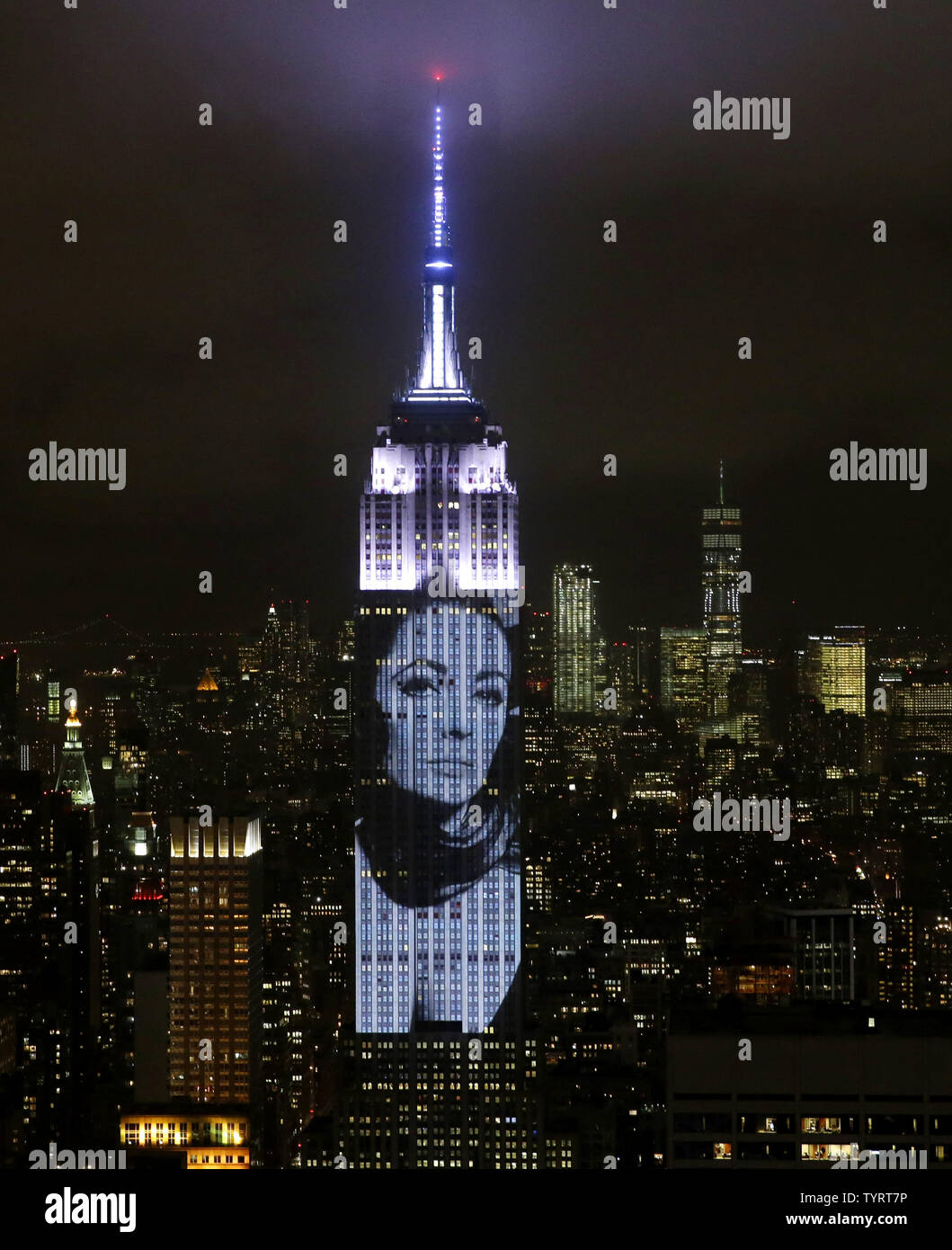 An artist rendering image of Elizabeth Taylor is projected onto the Empire State Building in the Manhattan skyline to celebrate Harper Bazaar's 150th anniversary on April 19, 2017 in New York City. Spanning 42 floors of the building and rising 500 feet high, the show featured iconic fashion images of everyone from Audrey Hepburn to Kate Moss, including iconic works by the likes of Andy Warhol.     Photo by John Angelillo/UPI Stock Photo