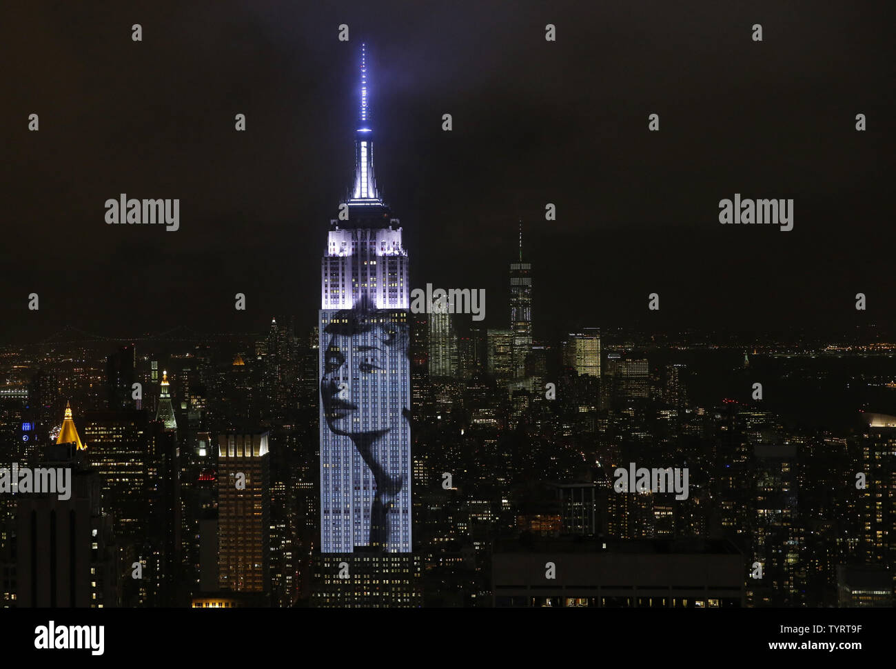 An artist rendering image of Audrey Hepburn is projected onto the Empire State Building in the Manhattan skyline to celebrate Harper BazaarÕs 150th anniversary on April 19, 2017 in New York City. Spanning 42 floors of the building and rising 500 feet high, the show featured iconic fashion images of everyone from Audrey Hepburn to Kate Moss, including iconic works by the likes of Andy Warhol.     Photo by John Angelillo/UPI Stock Photo