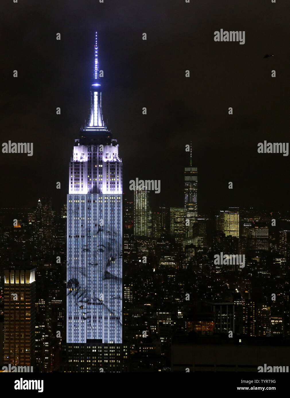 An artist rendering image of Marilyn Monroe is projected onto the Empire State Building in the Manhattan skyline to celebrate Harper Bazaar's 150th anniversary on April 19, 2017 in New York City. Spanning 42 floors of the building and rising 500 feet high, the show featured iconic fashion images of everyone from Audrey Hepburn to Kate Moss, including iconic works by the likes of Andy Warhol.     Photo by John Angelillo/UPI Stock Photo