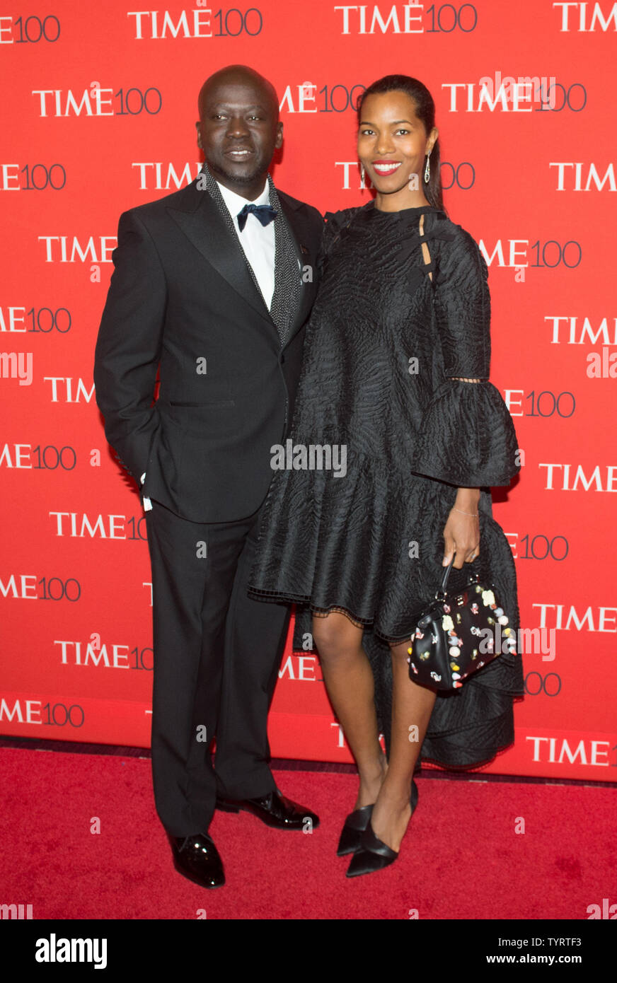 Sir David Adjaye and Ashley Shaw- Scott arrive on the red carpet at the TIME 100 Gala at Frederick P. Rose Hall, Home of Jazz at Lincoln Center, in New York City on April 26, 2017. TIME 100 celebrates TIME Magazine's list of the 100 Most Influential People in the World.      Photo by Bryan R. Smith/UPI Stock Photo