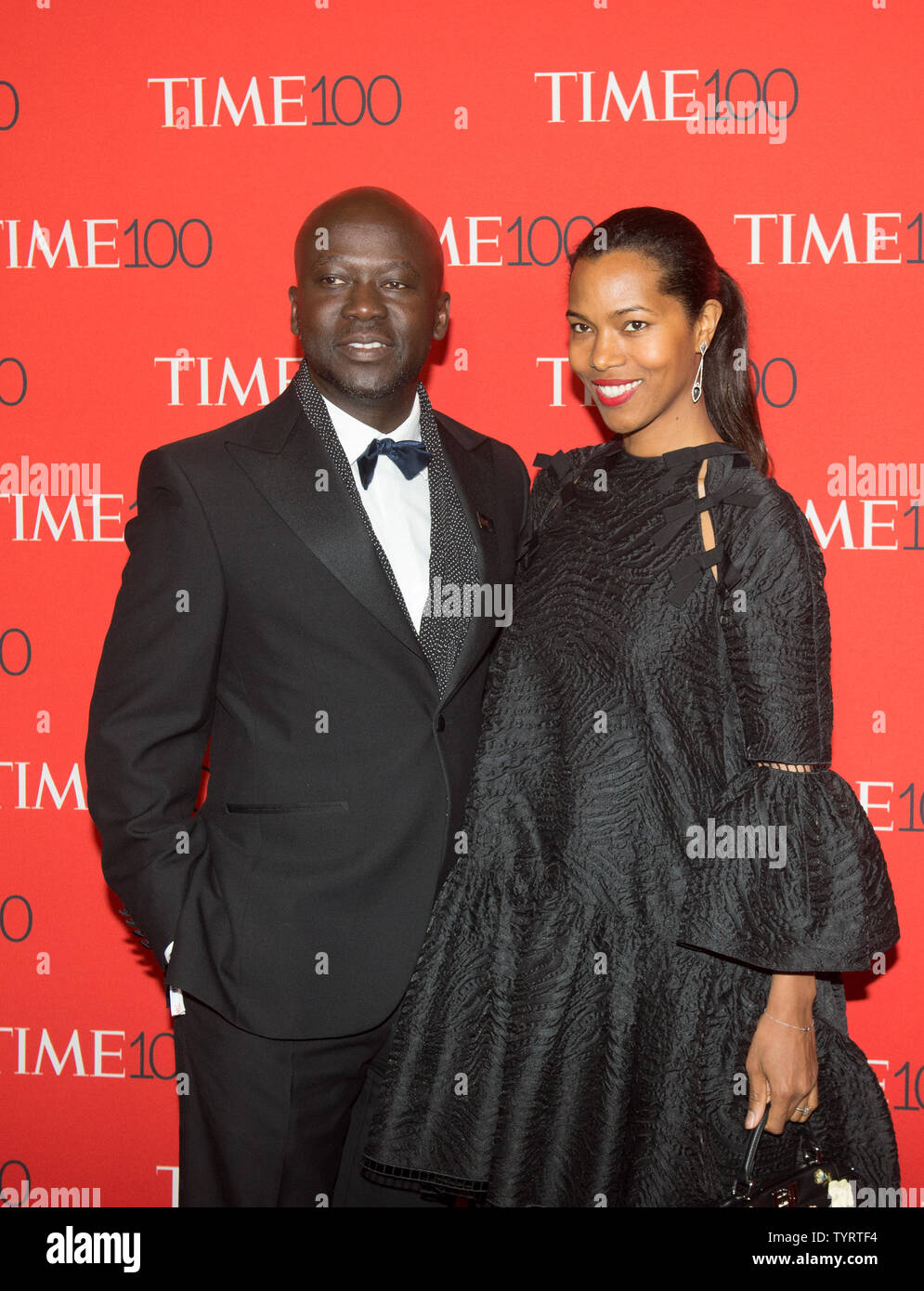 Sir David Adjaye and Ashley Shaw- Scott arrive on the red carpet at the TIME 100 Gala at Frederick P. Rose Hall, Home of Jazz at Lincoln Center, in New York City on April 26, 2017. TIME 100 celebrates TIME Magazine's list of the 100 Most Influential People in the World.      Photo by Bryan R. Smith/UPI Stock Photo