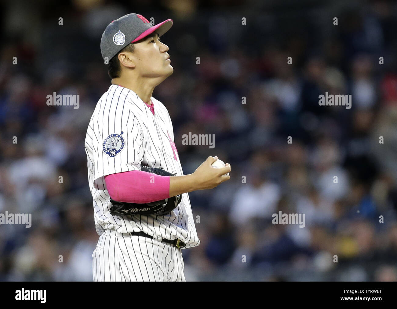 New York Yankees starting pitcher Masahiro Tanaka reacts after giving up a grand slam to Houston Astros Alex Bregman in the first inning at Yankee Stadium in New York City on May 14, 2017. The New York Yankees former shortstop Derek Jeter before the game had his No. 2 retired and was also honored with a plaque in Monument Park.     Photo by John Angelillo/UPI Stock Photo