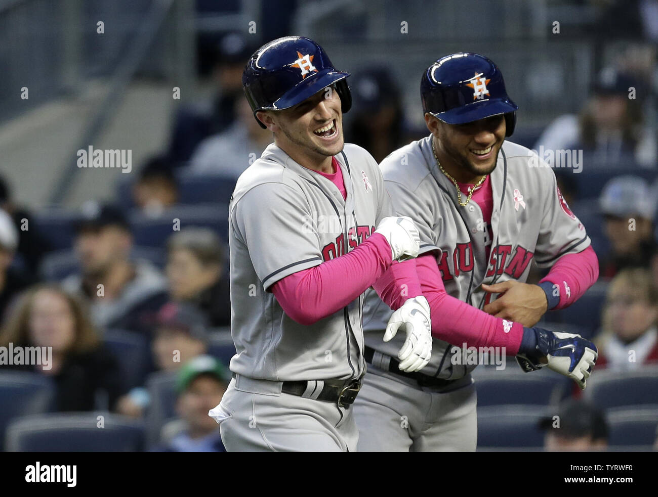 Houston Astros Alex Bregman celebrates with Yuli Gurriel after hitting a grand slam in the first inning off of New York Yankees starting pitcher Masahiro Tanaka at Yankee Stadium in New York City on May 14, 2017. The New York Yankees former shortstop Derek Jeter before the game had his No. 2 retired and was also honored with a plaque in Monument Park.     Photo by John Angelillo/UPI Stock Photo