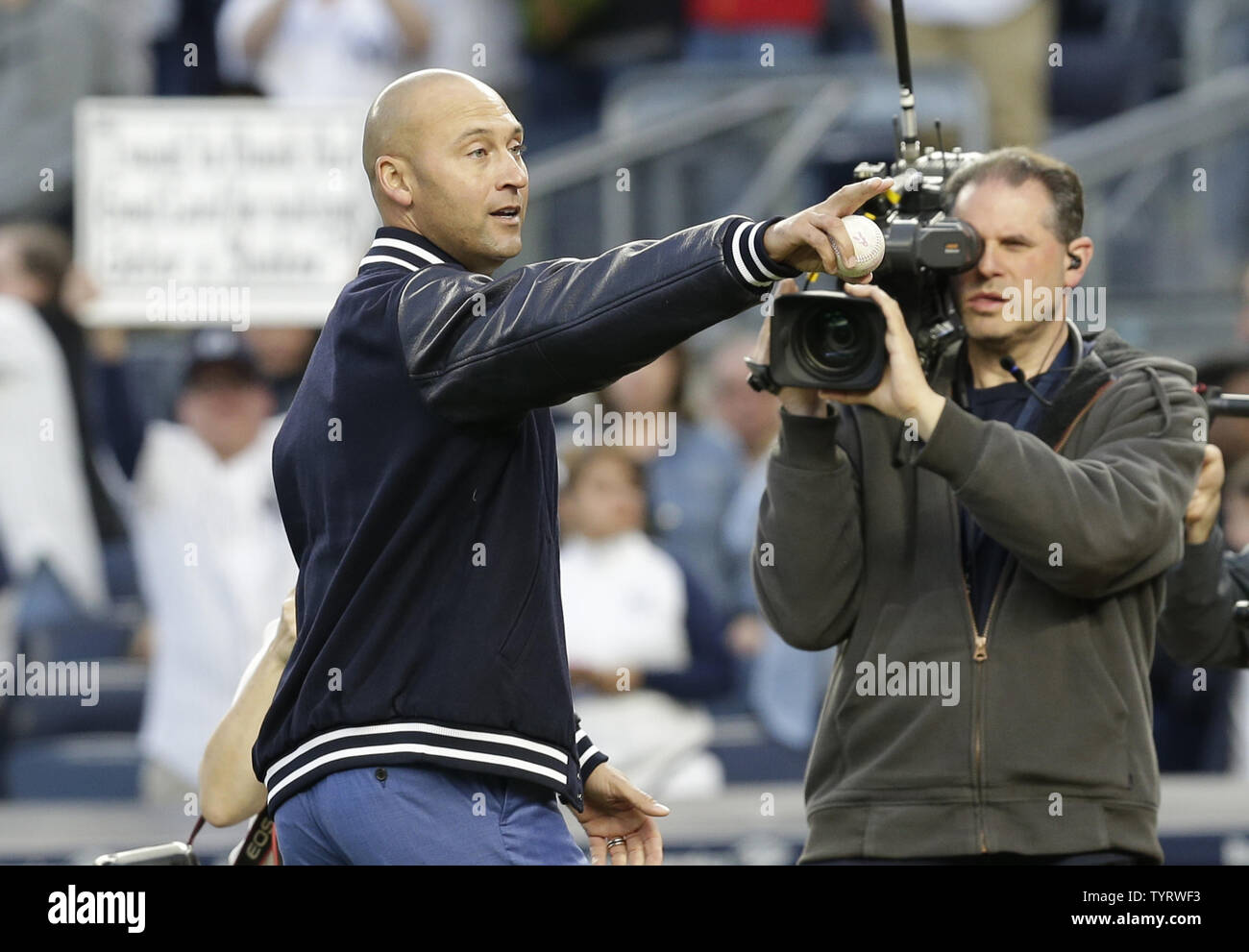 Derek Jeter throws out the first pitch after a ceremony retiring his number before the Houston Astros play the New York Yankees at Yankee Stadium in New York City on May 14, 2017. The New York Yankees former shortstop had his No. 2 retired and was also honored with a plaque in Monument Park.     Photo by John Angelillo/UPI Stock Photo