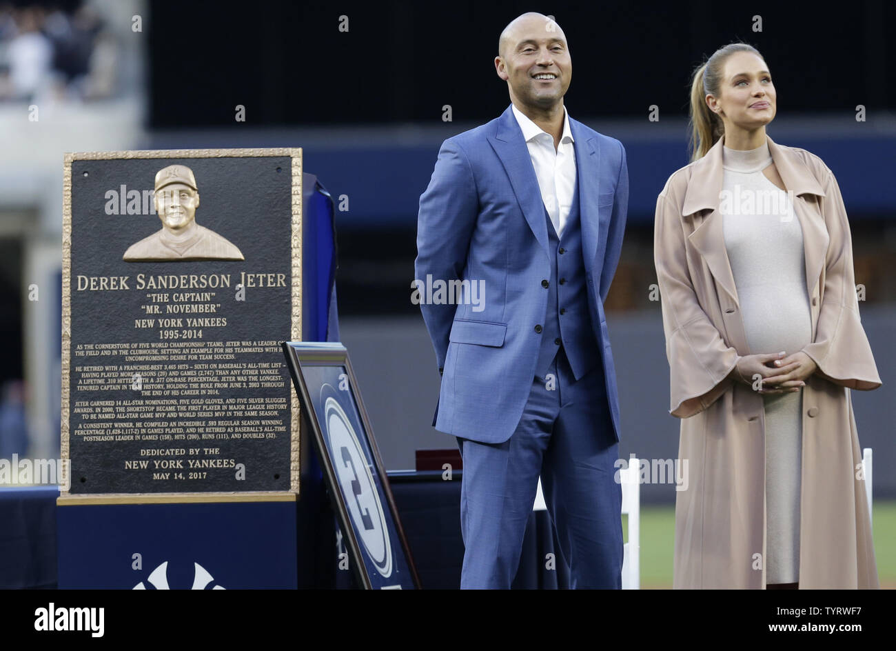 Derek Jeter stands on the field with Hannah Jeter for a ceremony retiring his number before the Houston Astros play the New York Yankees at Yankee Stadium in New York City on May 14, 2017. The New York Yankees former shortstop had his No. 2 retired and was also honored with a plaque in Monument Park.     Photo by John Angelillo/UPI Stock Photo