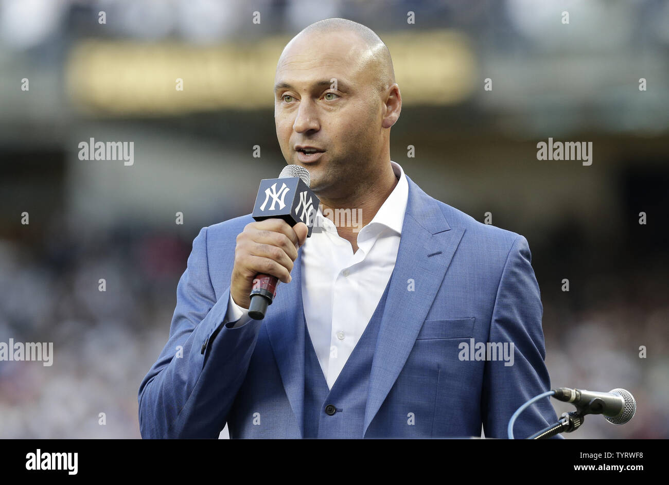 Derek Jeter speaks on the field at a ceremony retiring his number before the Houston Astros play the New York Yankees at Yankee Stadium in New York City on May 14, 2017. The New York Yankees former shortstop had his No. 2 retired and was also honored with a plaque in Monument Park.     Photo by John Angelillo/UPI Stock Photo