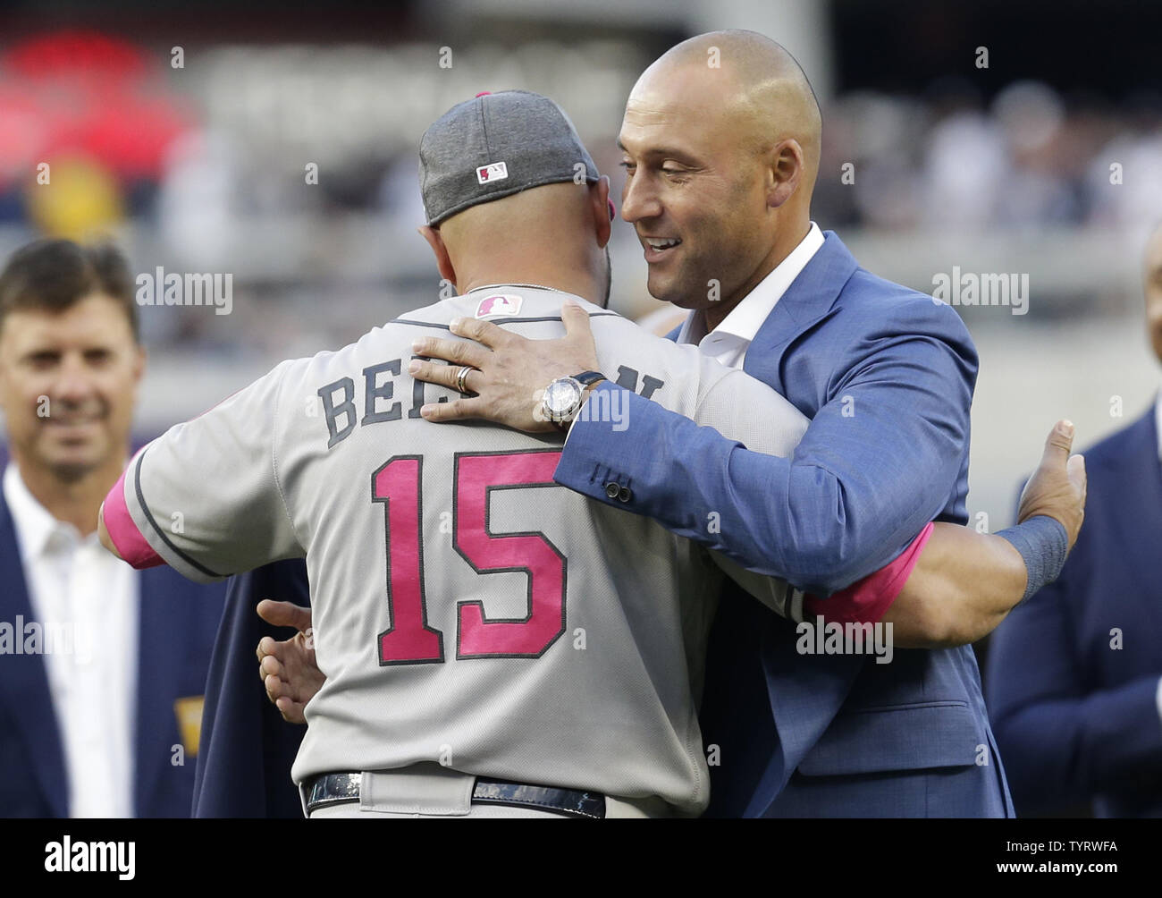 Derek Jeter hugs Carlos Beltran on the field at a ceremony retiring his number before the Houston Astros play the New York Yankees at Yankee Stadium in New York City on May 14, 2017. The New York Yankees former shortstop had his No. 2 retired and was also honored with a plaque in Monument Park.     Photo by John Angelillo/UPI Stock Photo