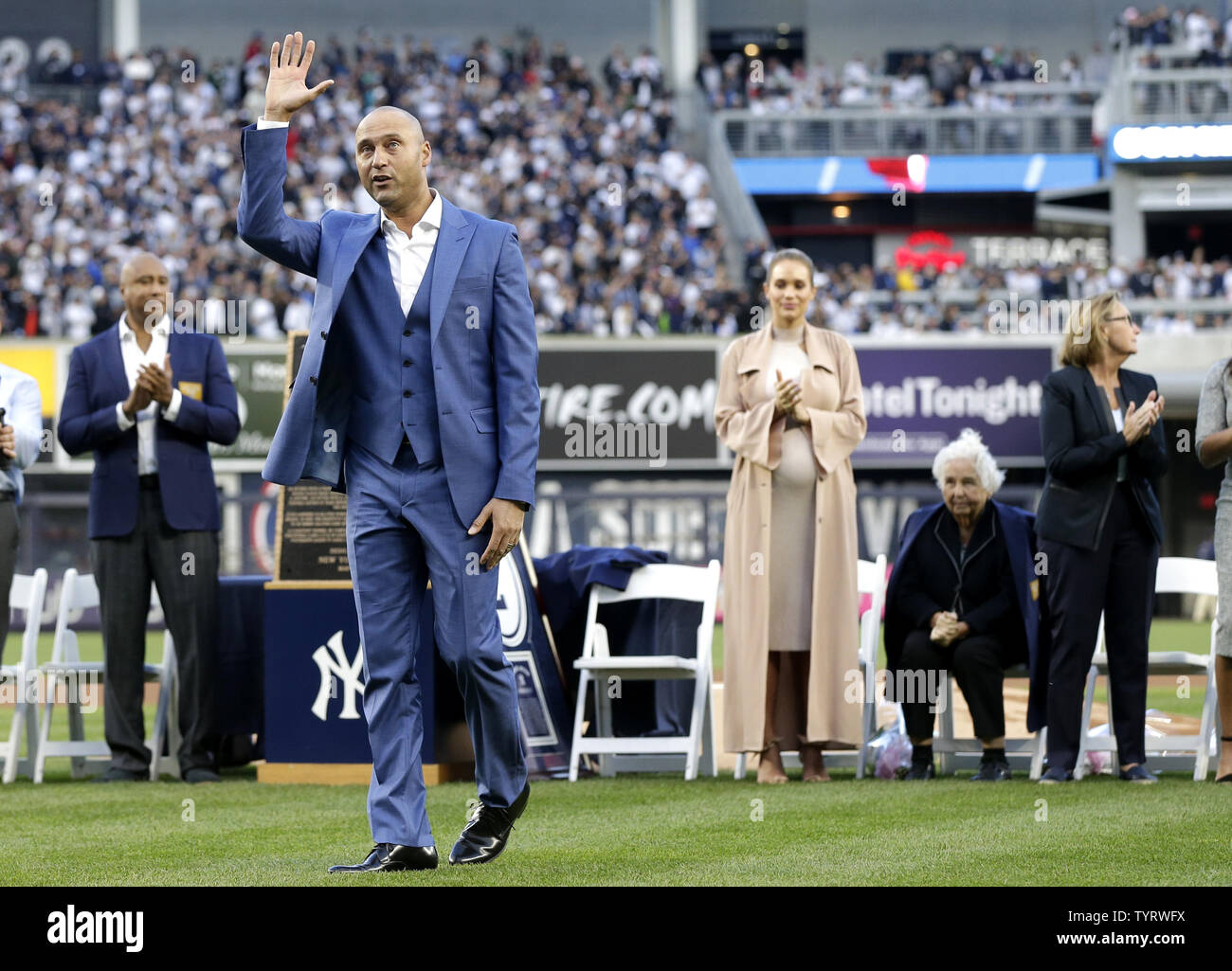 Derek Jeter waves to fans on the field with at a ceremony retiring his number before the Houston Astros play the New York Yankees at Yankee Stadium in New York City on May 14, 2017. The New York Yankees former shortstop had his No. 2 retired and was also honored with a plaque in Monument Park.     Photo by John Angelillo/UPI Stock Photo