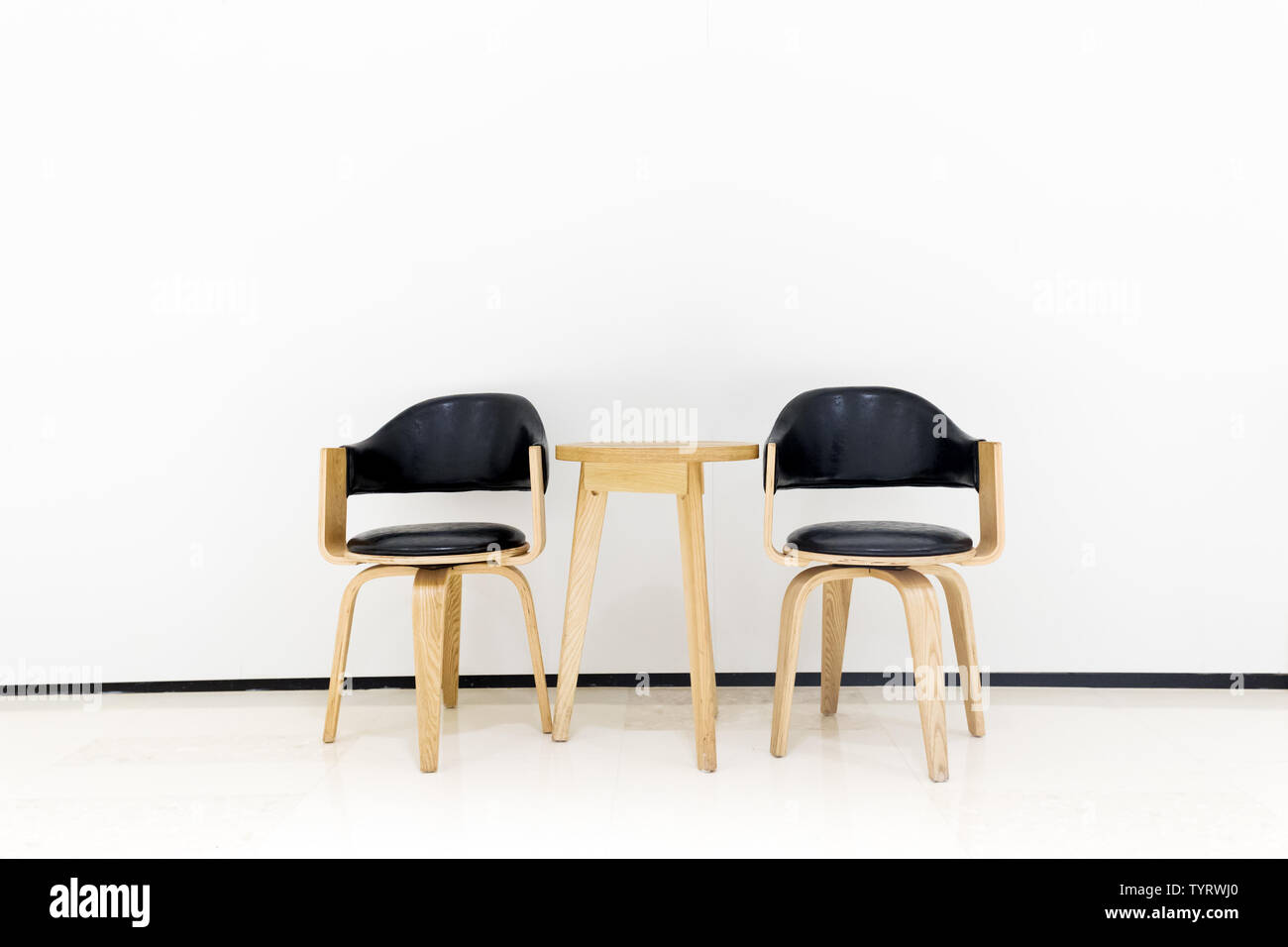 White table with white chairs Cut Out Stock Images & Pictures - Alamy