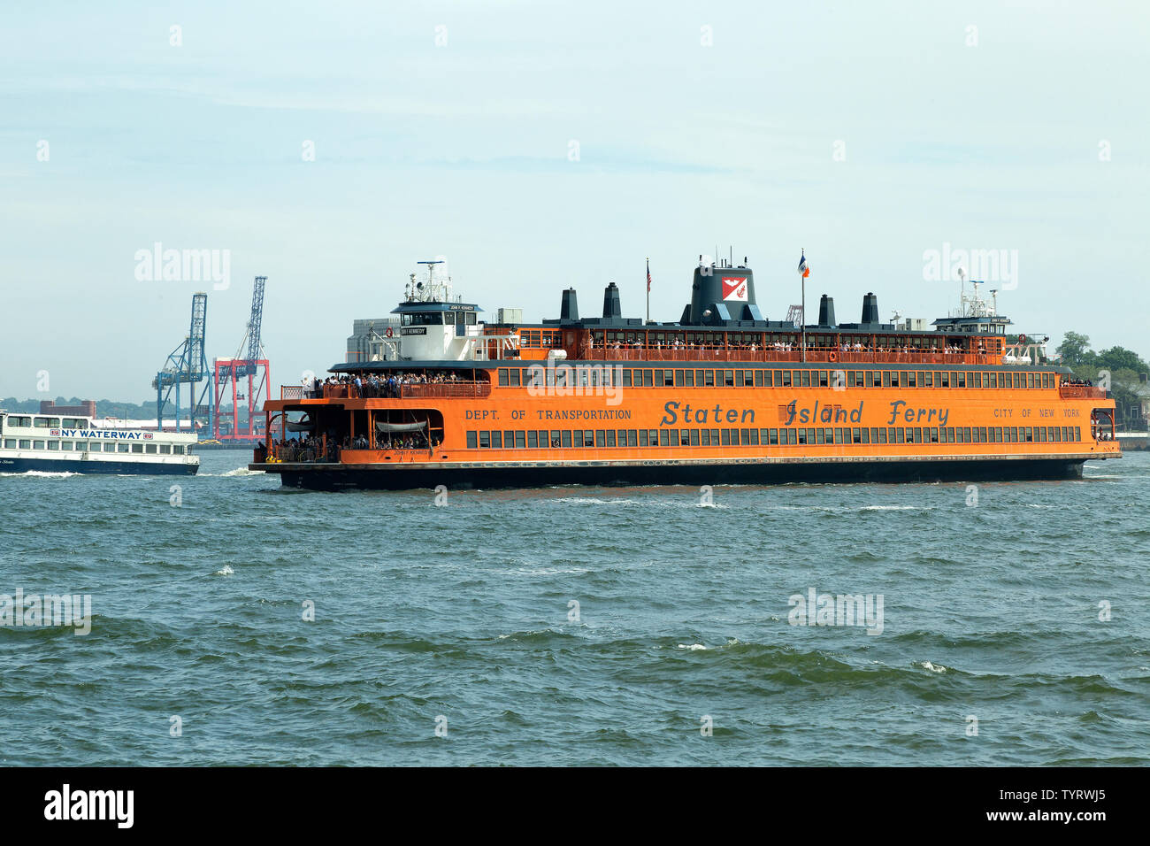 The Staten Island Ferry is a passenger ferry route that transports commuters between New York Harbor between Manhattan and Staten Island Stock Photo