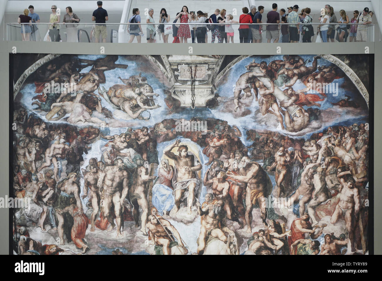 People Stand Over And Take Pictures Of Painting Reproductions Of