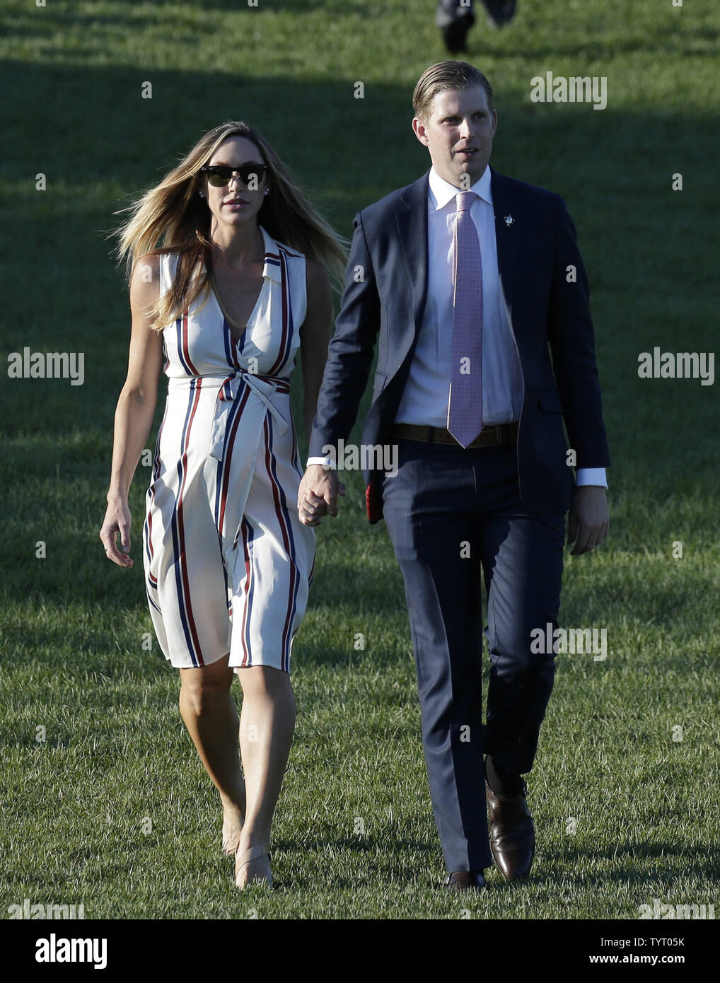 Eric and Lara Trump walk to the trophy ceremony at Trump National Golf Club after the final round of the LPGA U.S. Women's Open Championship in Bedminster, NJ on July 14, 2017. Sung Hyun Park of South Korea won her first major with a score of 11 under par.      Photo by John Angelillo/UPI Stock Photo
