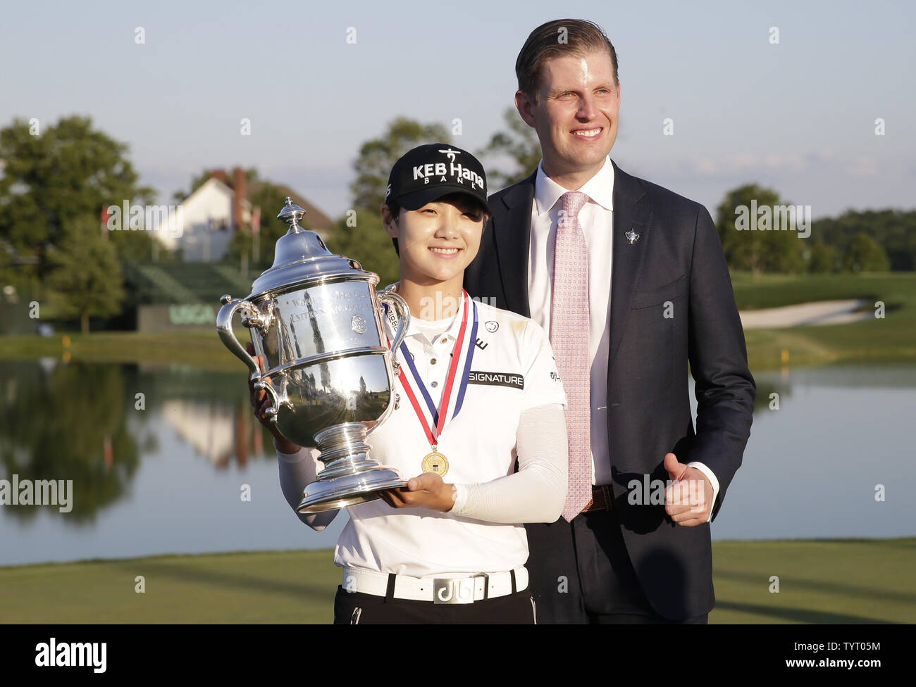 Eric Trump stands with Rookie Sung Hyun Park of South Korea who holds the championship trophy at Trump National Golf Club after the final round of the LPGA U.S. Women's Open Championship  in Bedminster, NJ on July 14, 2017. Park wins her first major with a score of 11 under par.      Photo by John Angelillo/UPI Stock Photo