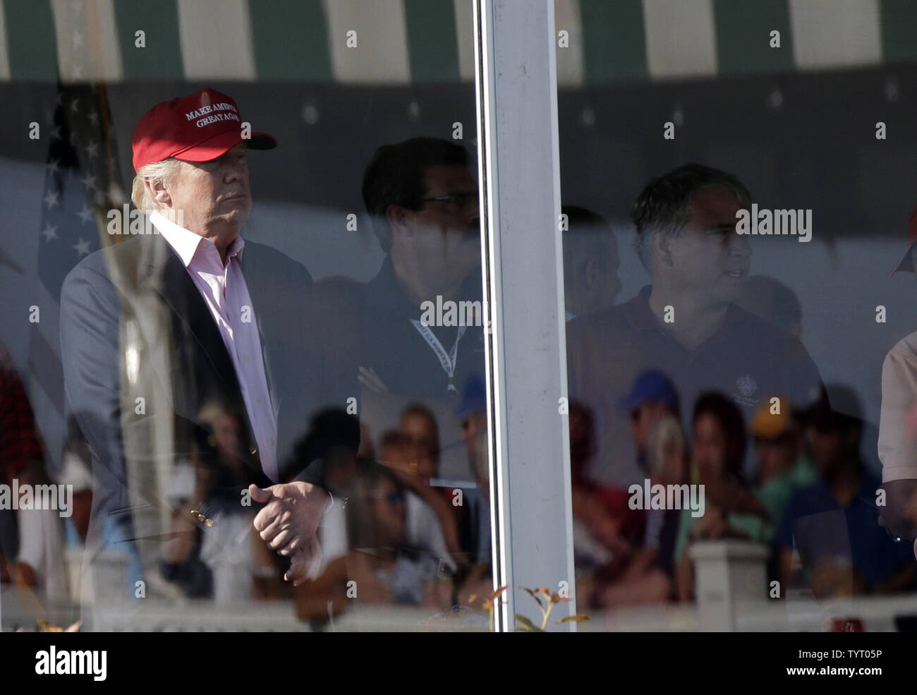 United States President Donald Trump watches the play on the golf course at Trump National Golf Club in the final round of the LPGA U.S. Women's Open Championship  in Bedminster, NJ on July 14, 2017. Park wins her first major with a score of 11 under par.      Photo by John Angelillo/UPI Stock Photo