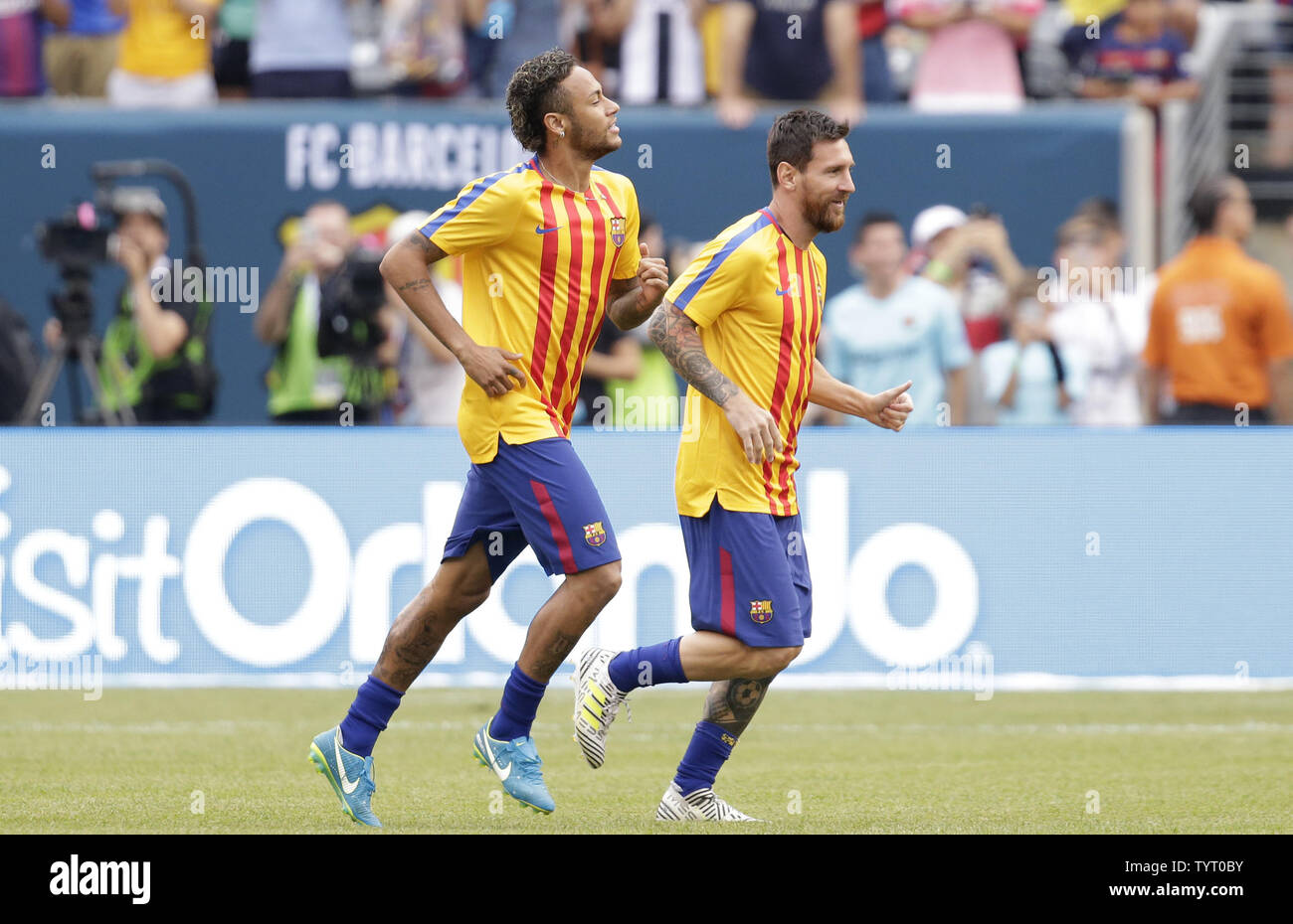 Lionel Messi and Neymar of Barcelona take the field before the game against  Juventus at The International Champions Cup at Metlife Stadium in East  Rutherford, New Jersey on July 22, 2017. Photo