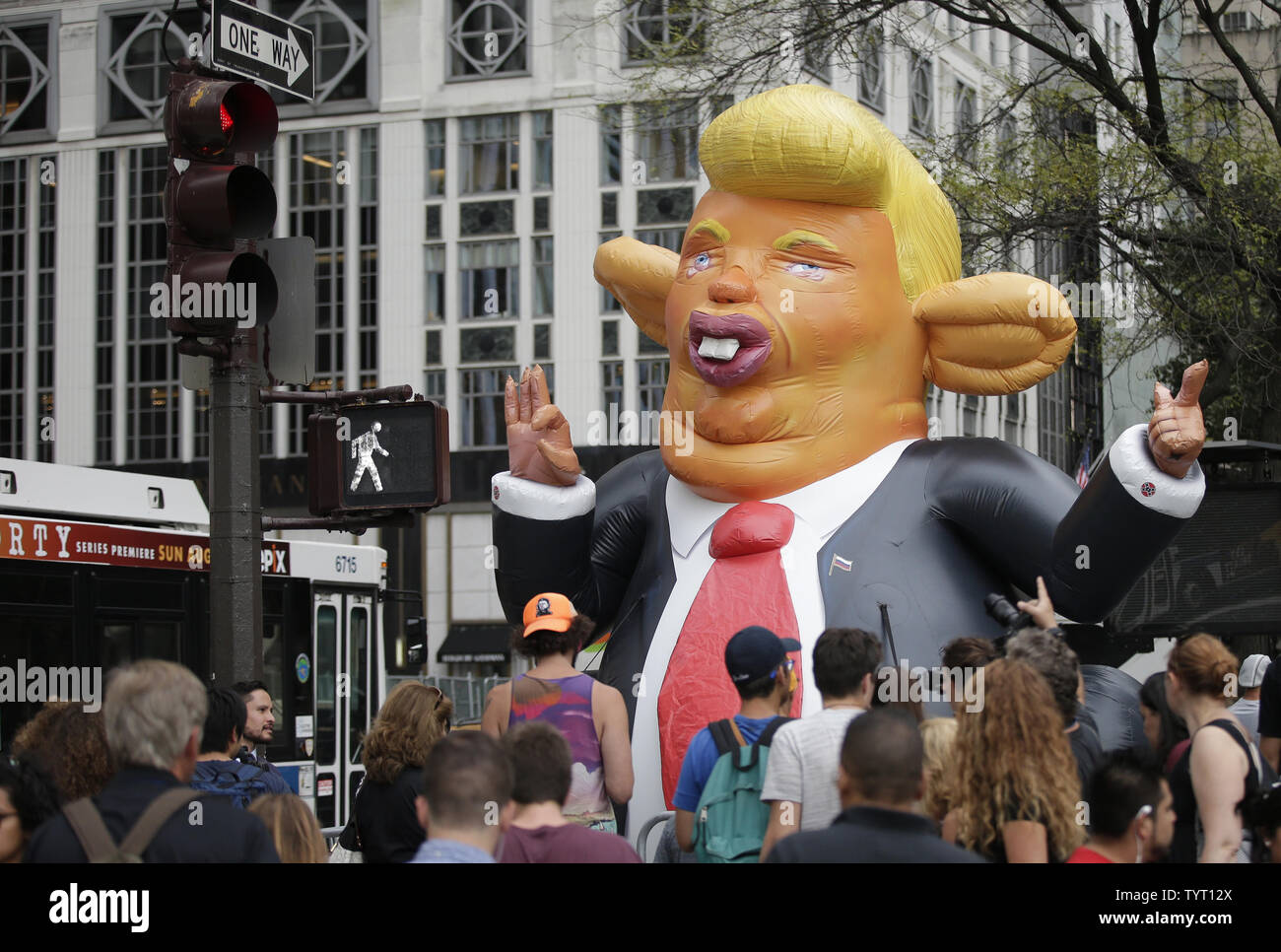 An inflatable Trump chicken balloon is parked on Fifth Avenue at a protest on August 14, 2017 at Trump Tower in New York City. Thousands of protesters crowded the streets around Trump Tower. The protest follows a series of rallies across New York City and the country due to President Donald Trump's response to the fatal white nationalist rally in Charlottesville, Virginia over the weekend.      Photo by John Angelillo/UPI Stock Photo