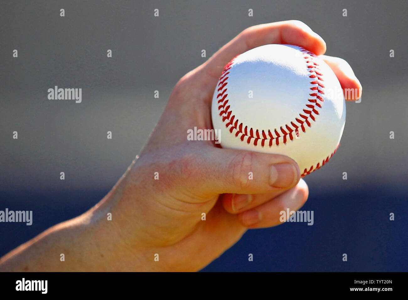 Pitcher gripping a baseball. Stock Photo