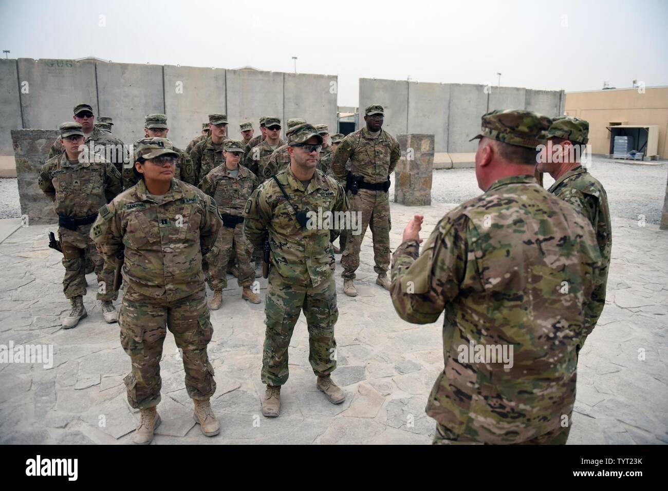 Air Force Chief Master Sgt. Mitchell Brush, senior enlisted advisor to the chief of the National Guard Bureau, talks with members of the Indiana National Guard's 938th Military Police Detachment during a Thanksgiving Day troop visit, Kandahar, Afghanistan, Nov. 24, 2016. Stock Photo