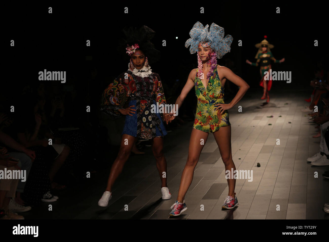Models walk the runway at the Desigual fashion show during New York ...