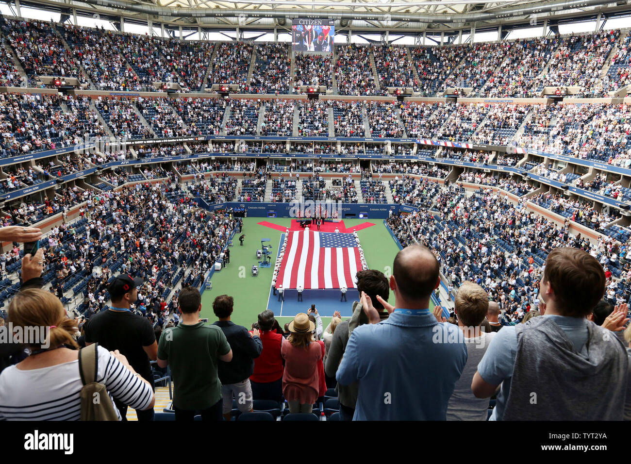 A giant American flag is displayed during the opening ceremony for the men's championship finals match at the US Open Tennis Championships at the USTA Billie Jean King National Tennis Center in New York City on September 10, 2017.     Photo by Monika Graff/UPI. Stock Photo