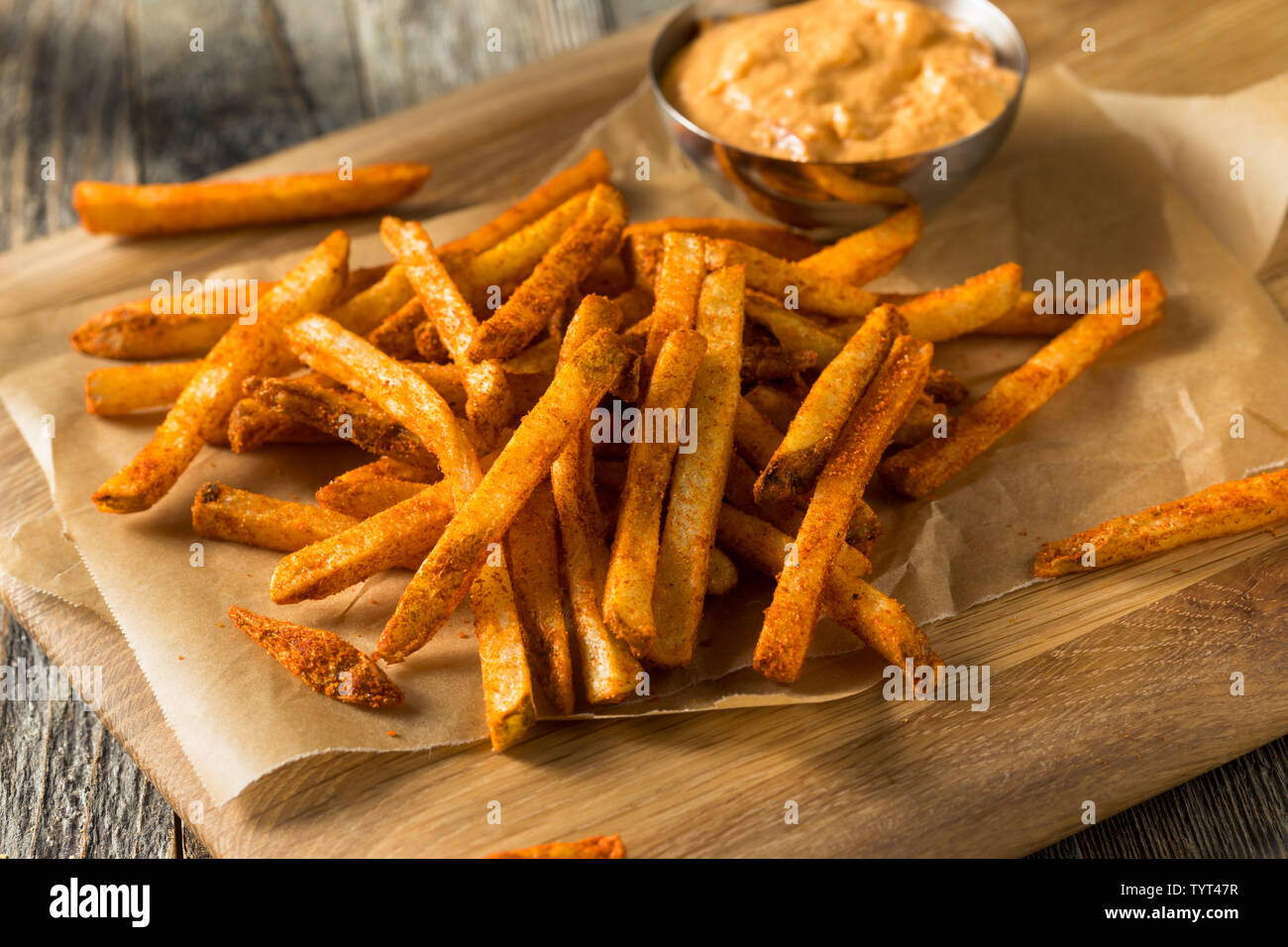 Homemade Spicy Mexican Nacho Fries with Cheese Sauce Stock Photo