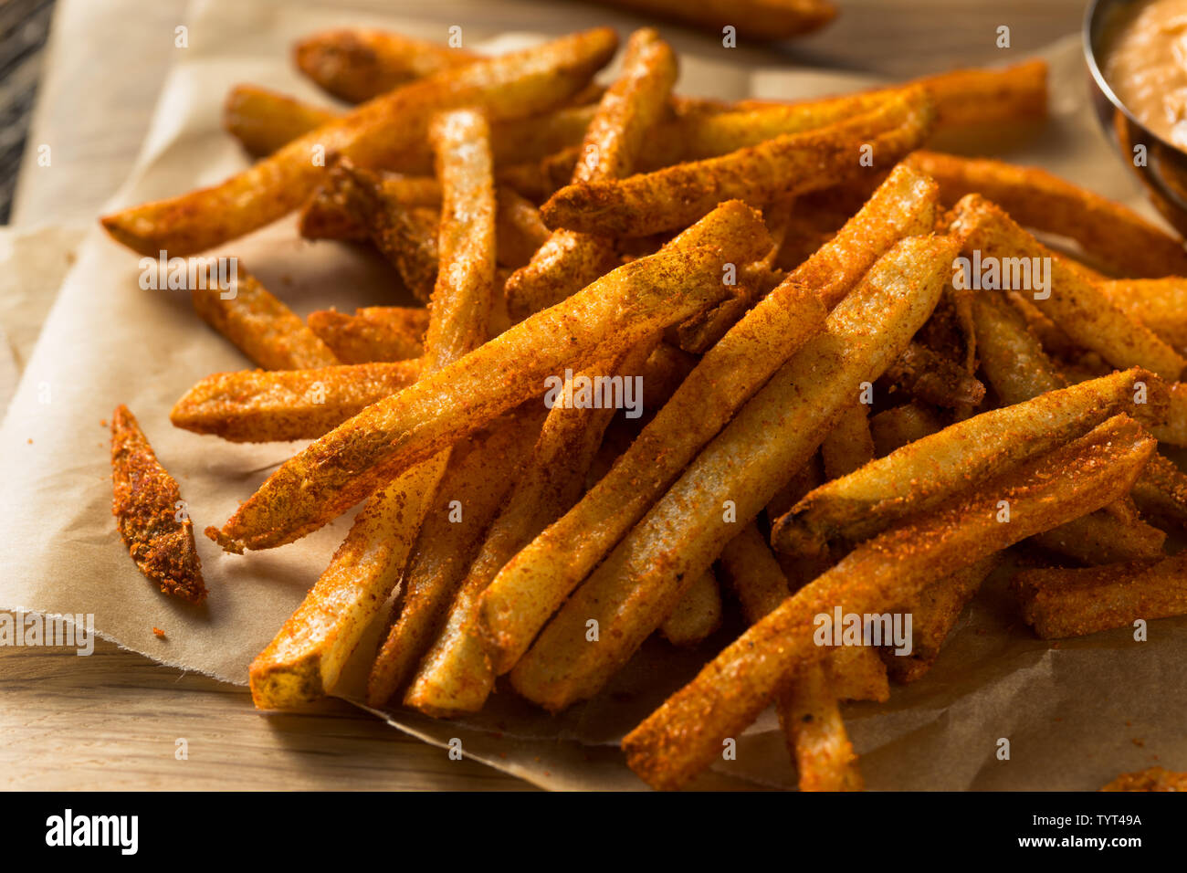 Homemade Spicy Mexican Nacho Fries with Cheese Sauce Stock Photo