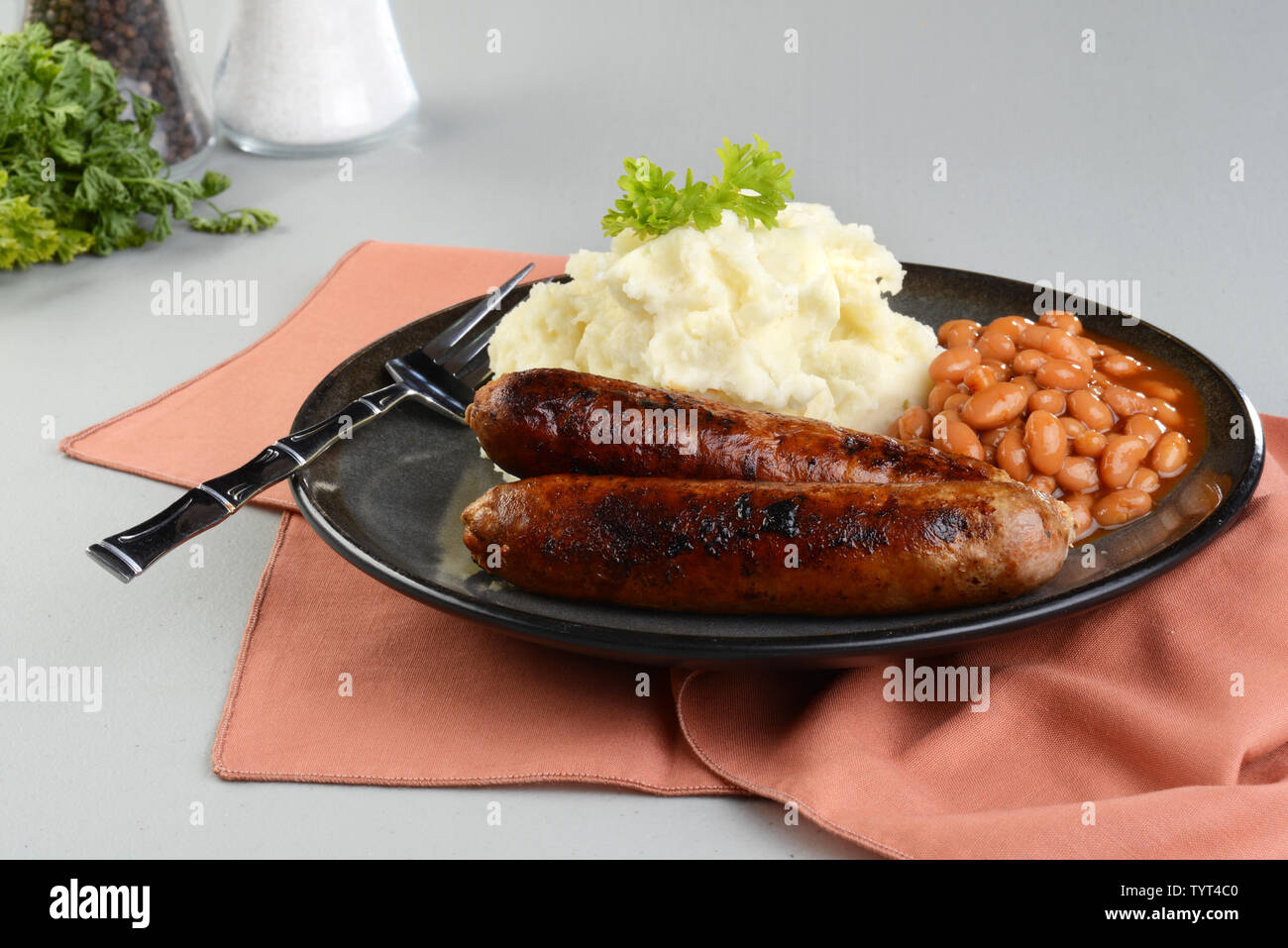 chorizo sausages with mashed potato and baked beans Stock Photo Alamy