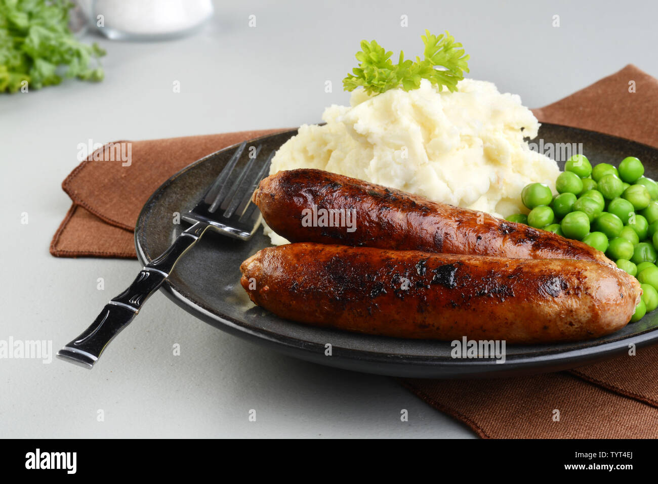 chorizo sausages with mashed potato and green peas Stock Photo