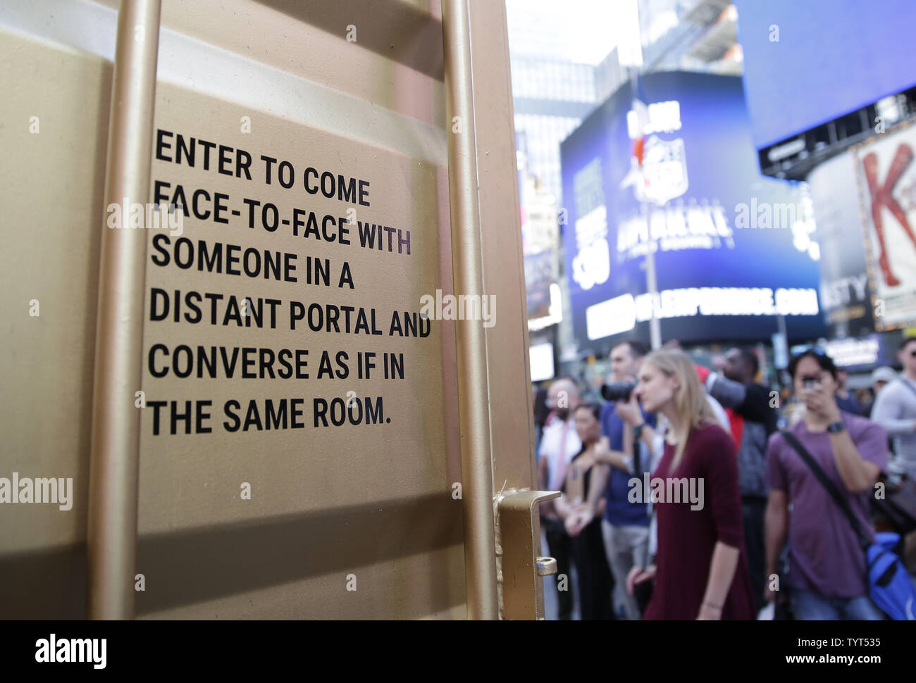 A gold crate that allows Times Square visitors to interact with people across thirty locations in twenty countries as though they are in the same room stands in Times Square at a press opening for  a new interactive arts installation titled TimesSquare Portal on October 10, 2017 in New York City. TimesSquare Portal will run from October 10 to November 21, 2017.      Photo by John Angelillo/UPI Stock Photo