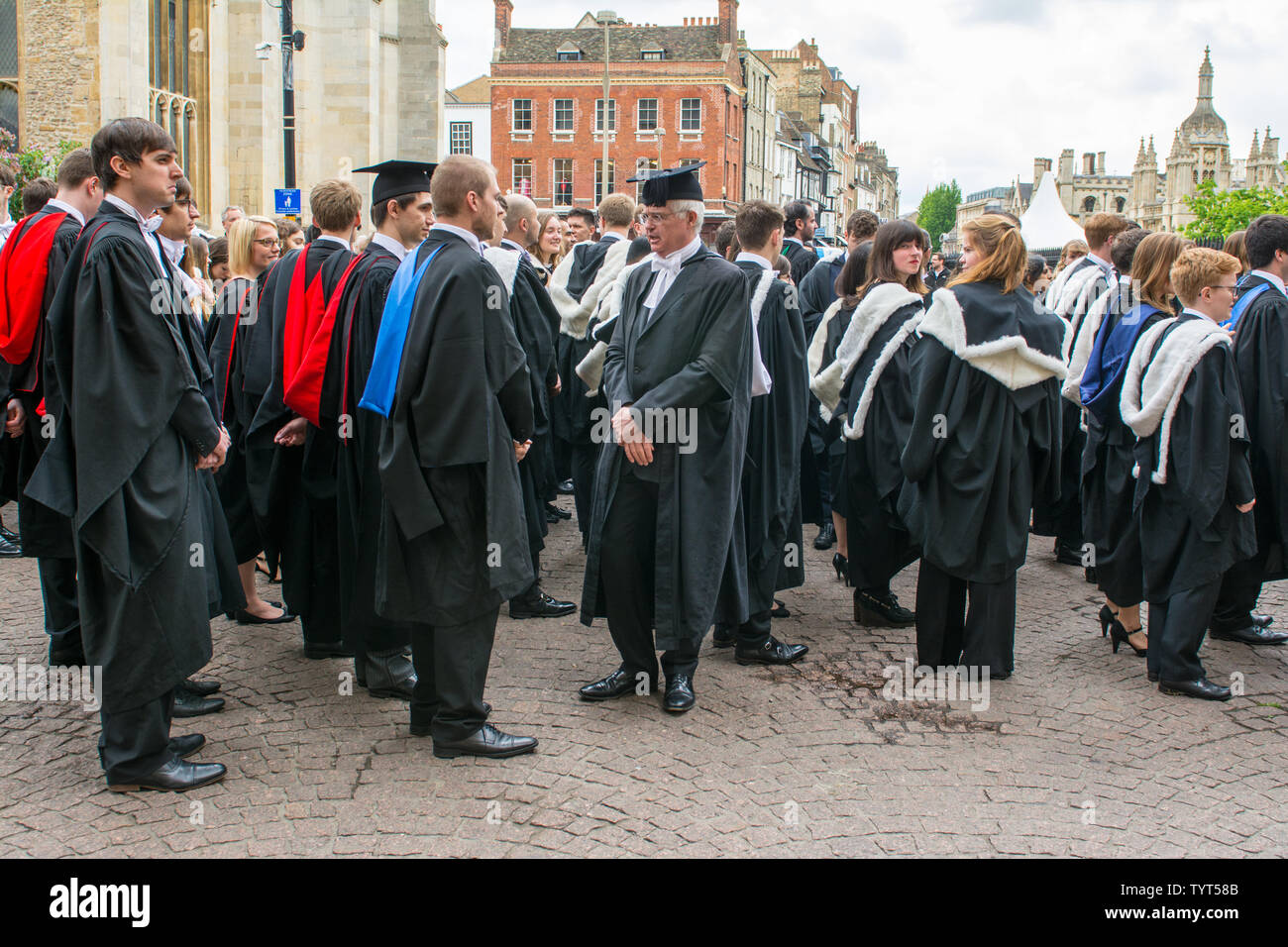 Cambridge uk, 20190518, young adults standing outisde the Senate house where the graduation