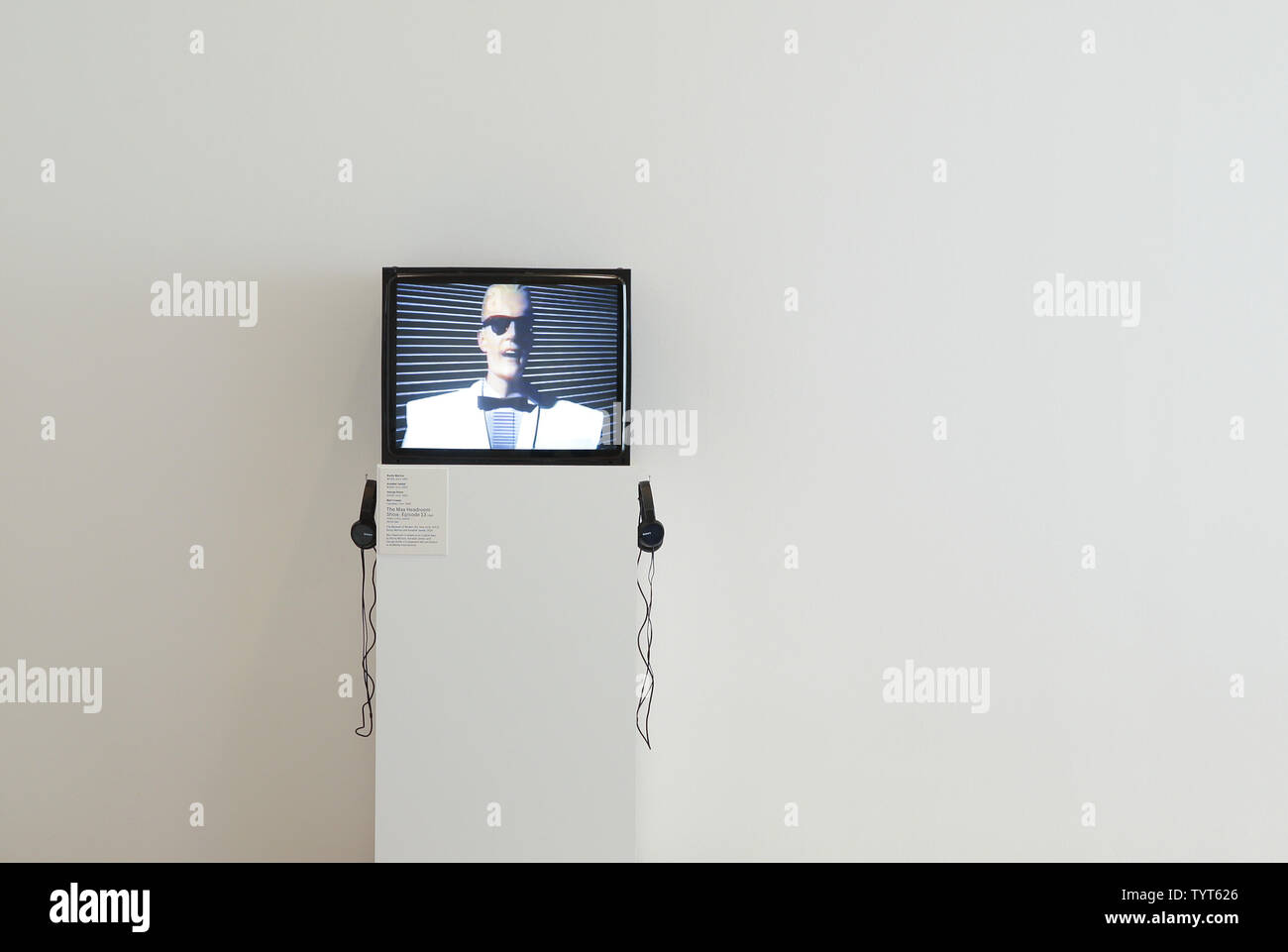 An episode of Max Headroom on a small tv screen is on display at a 