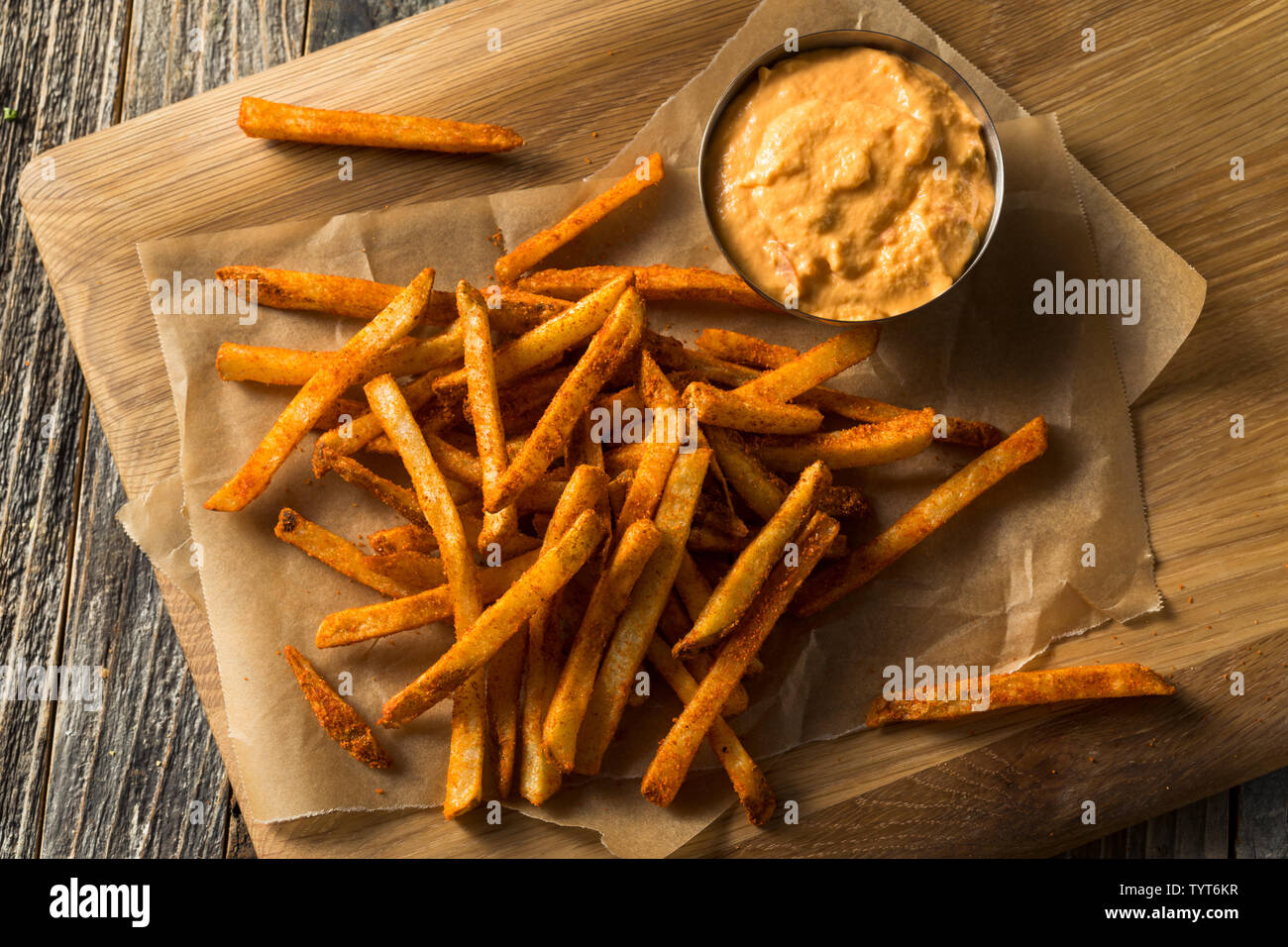 Homemade Spicy Mexican Nacho Fries with Cheese Sauce Stock Photo
