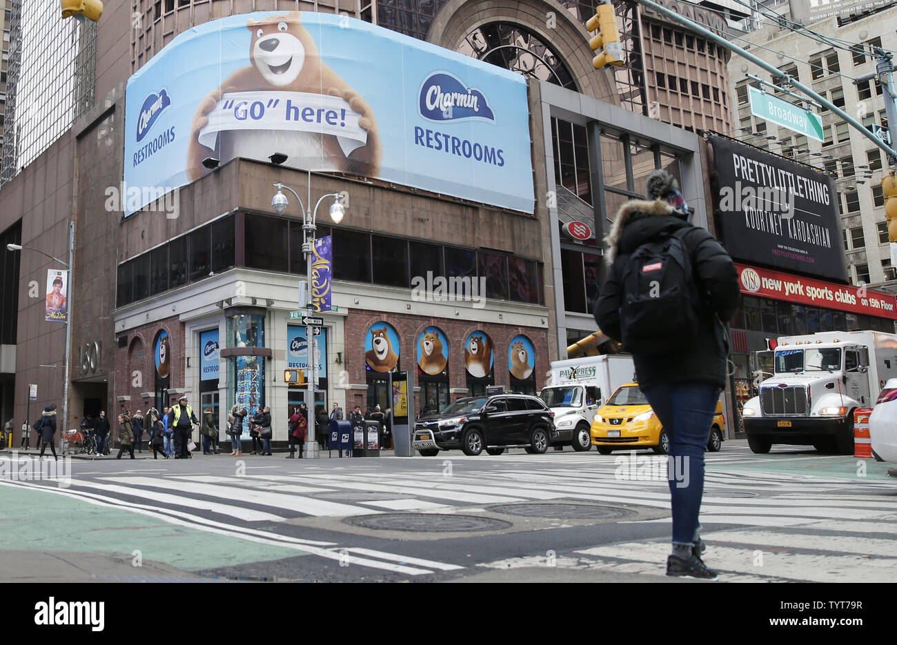 Pedestrians walk by a a store of Charmin Restrooms in Times Square in