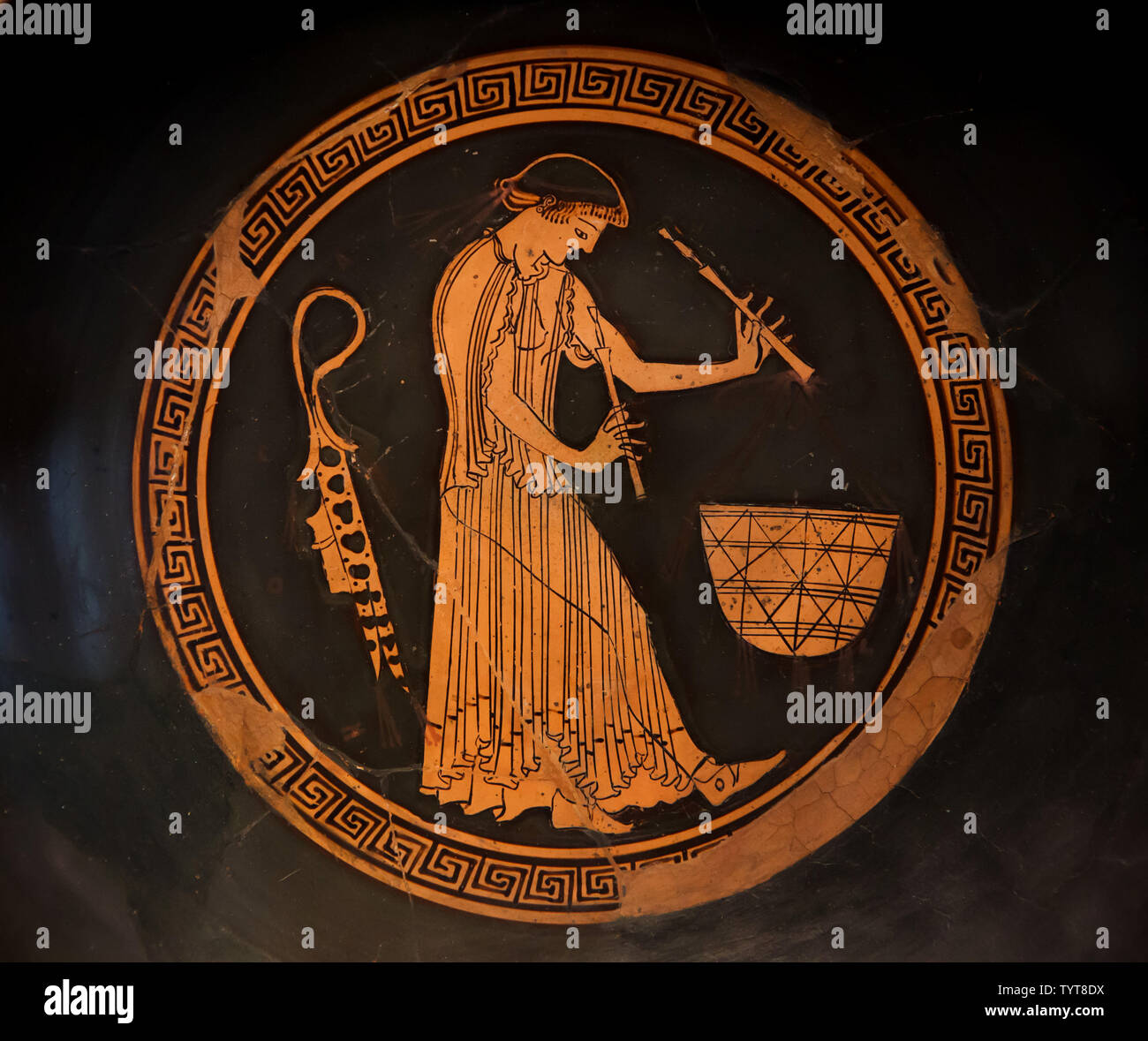 Flutist in front of a food basket depicted in the Attic red-figure drinking cup by the Douris Painter dated from around 480 BC on display in the Altes Museum in Berlin, Germany. Stock Photo