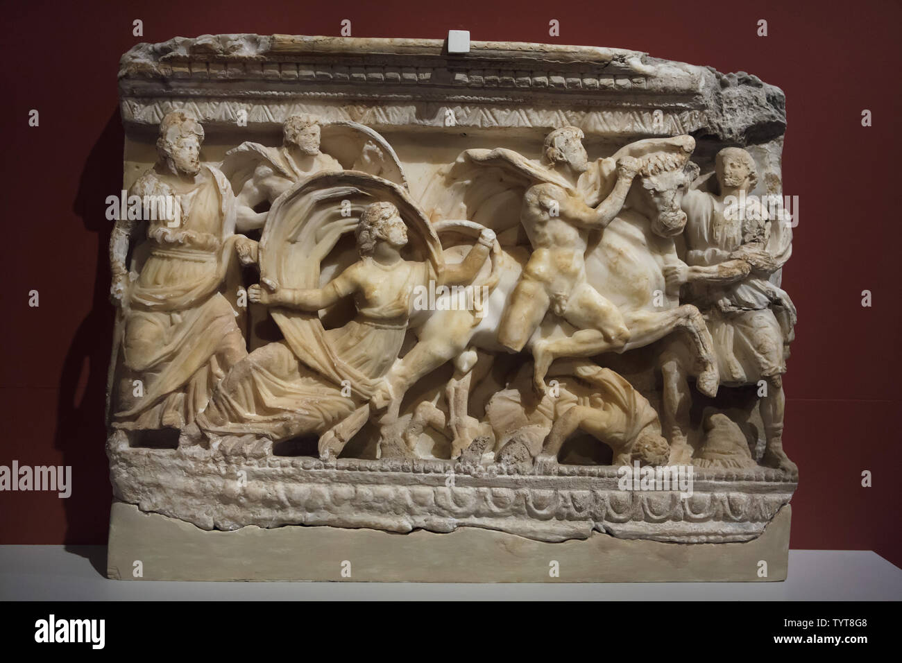 Punishment of Dirce by brothers Amphion and Zethus depicted on the front of the Etruscan alabaster cinerary urn dated from around 120-110 BC found in Volterra, Italy, now on display in the Altes Museum in Berlin, Germany. Stock Photo