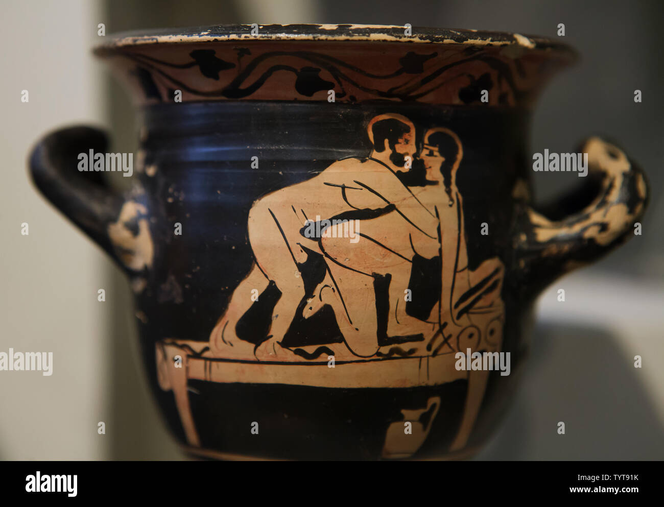 Erotic scene depicted in the Attic red-figure vase dated from late 6th to late 5th century BC on display in the Altes Museum in Berlin, Germany. Stock Photo