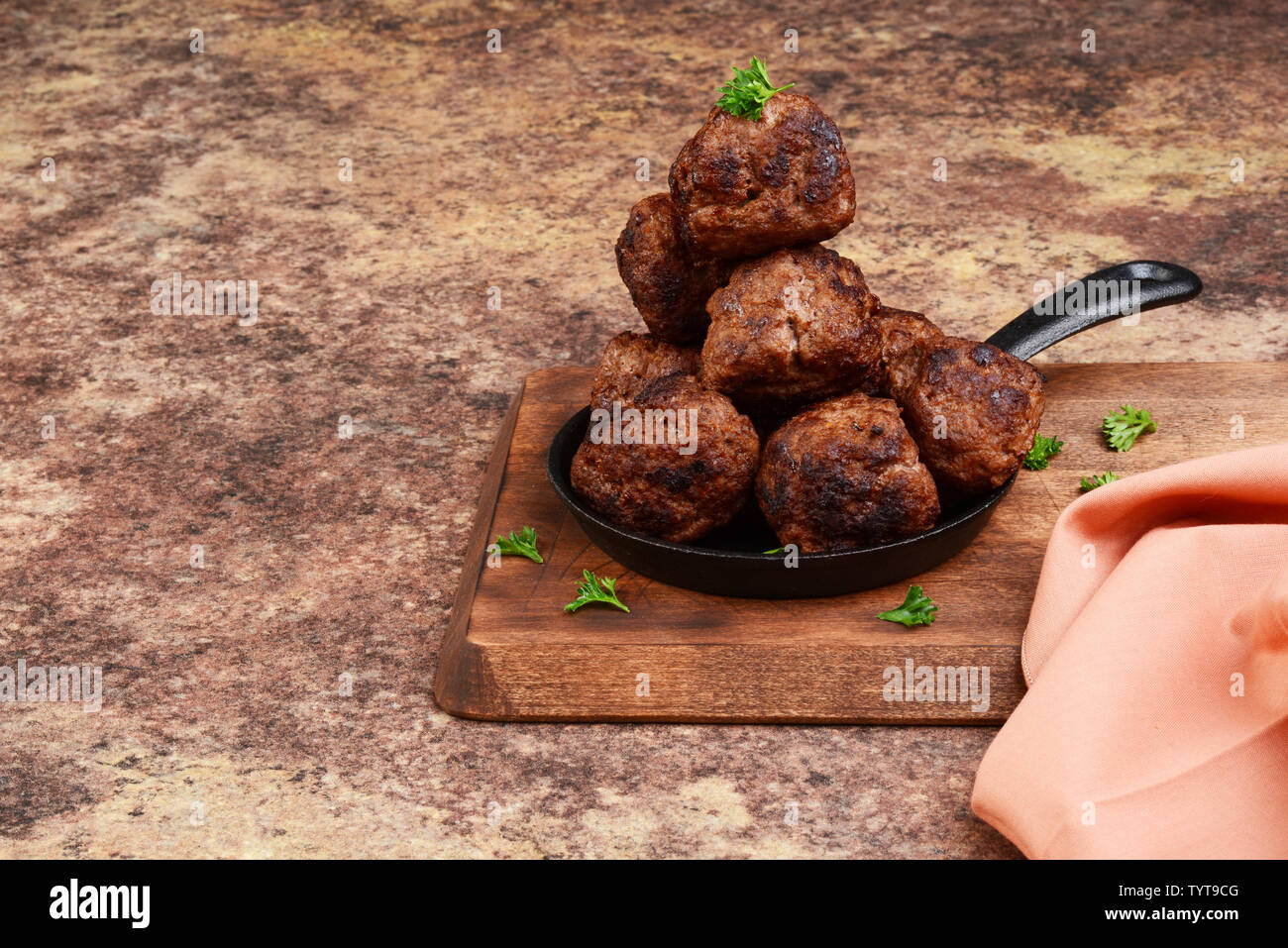 pile of meatballs in cast iron frying pan Stock Photo Alamy