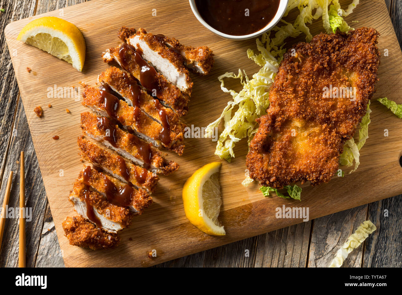 Homemade Japanese Pork Tonkatsu with Cabbage and Sauce Stock Photo