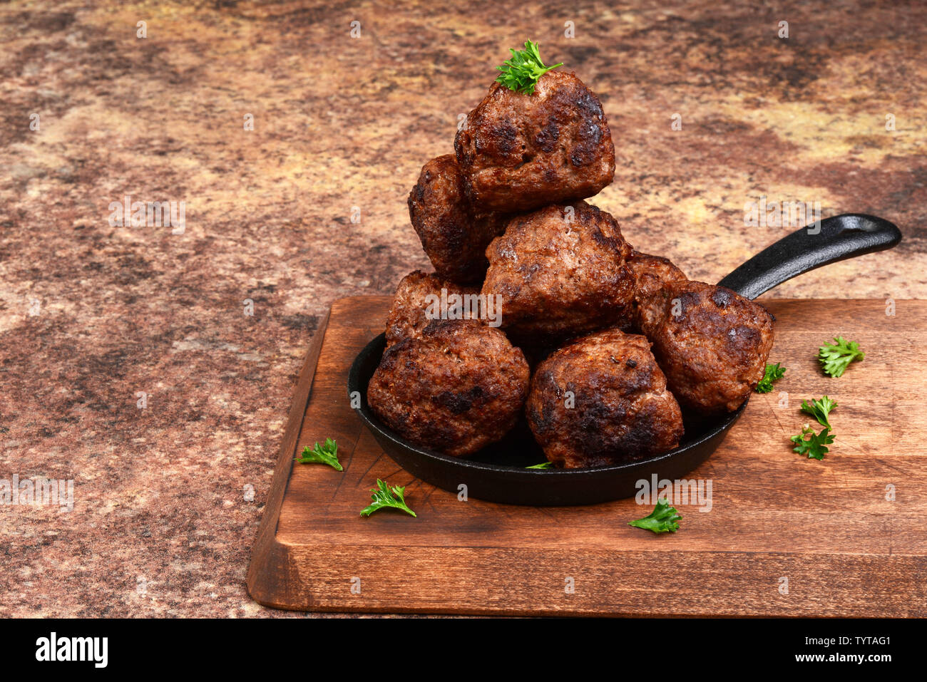 stack of meatballs in cast iron skillet Stock Photo Alamy
