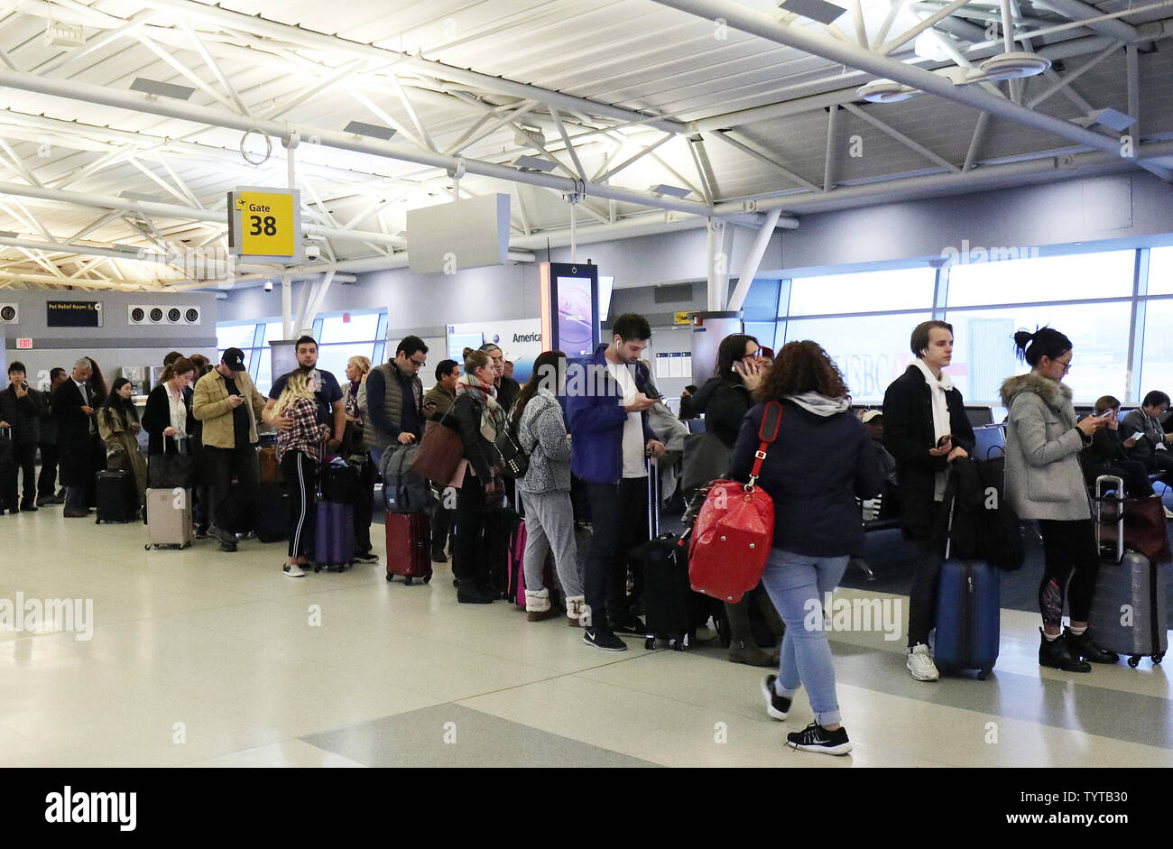 Passengers remain at the gates and wait on long lines to reschedule travel on a day where flights were canceled do to bad weather at JFK Airport in New York City on March 2, 2018. A Nor'easter slamming the Tri-State Friday grounded flights at John F. Kennedy Airport and forced airlines to cancel hundreds of flights at other area airports. More than 1,500 flights at the three major airports were grounded.     Photo by John Angelillo/UPI Stock Photo